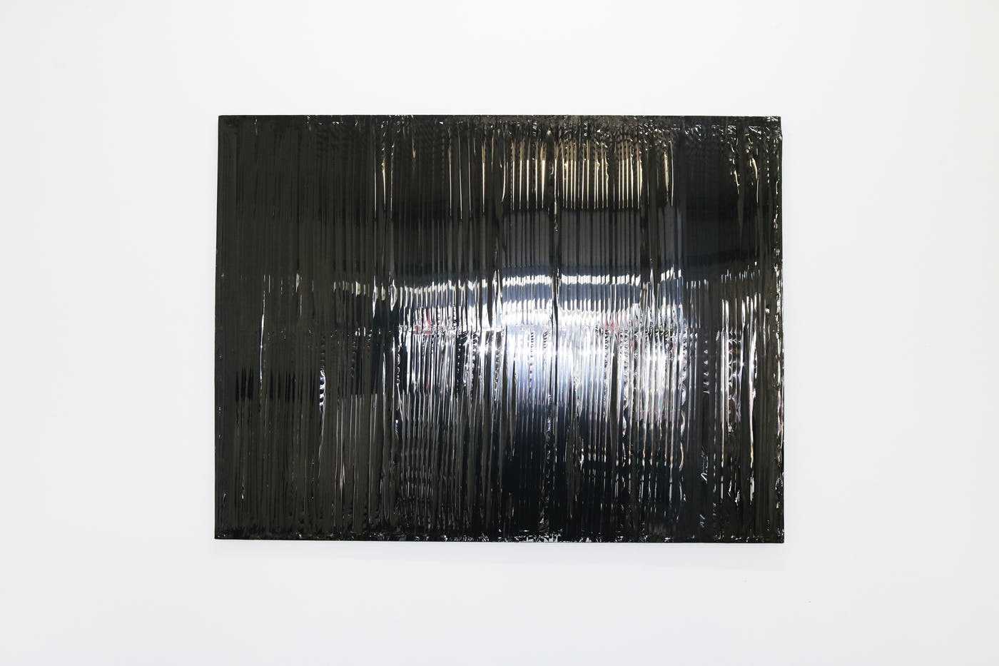 A rectangle of shiny black material.