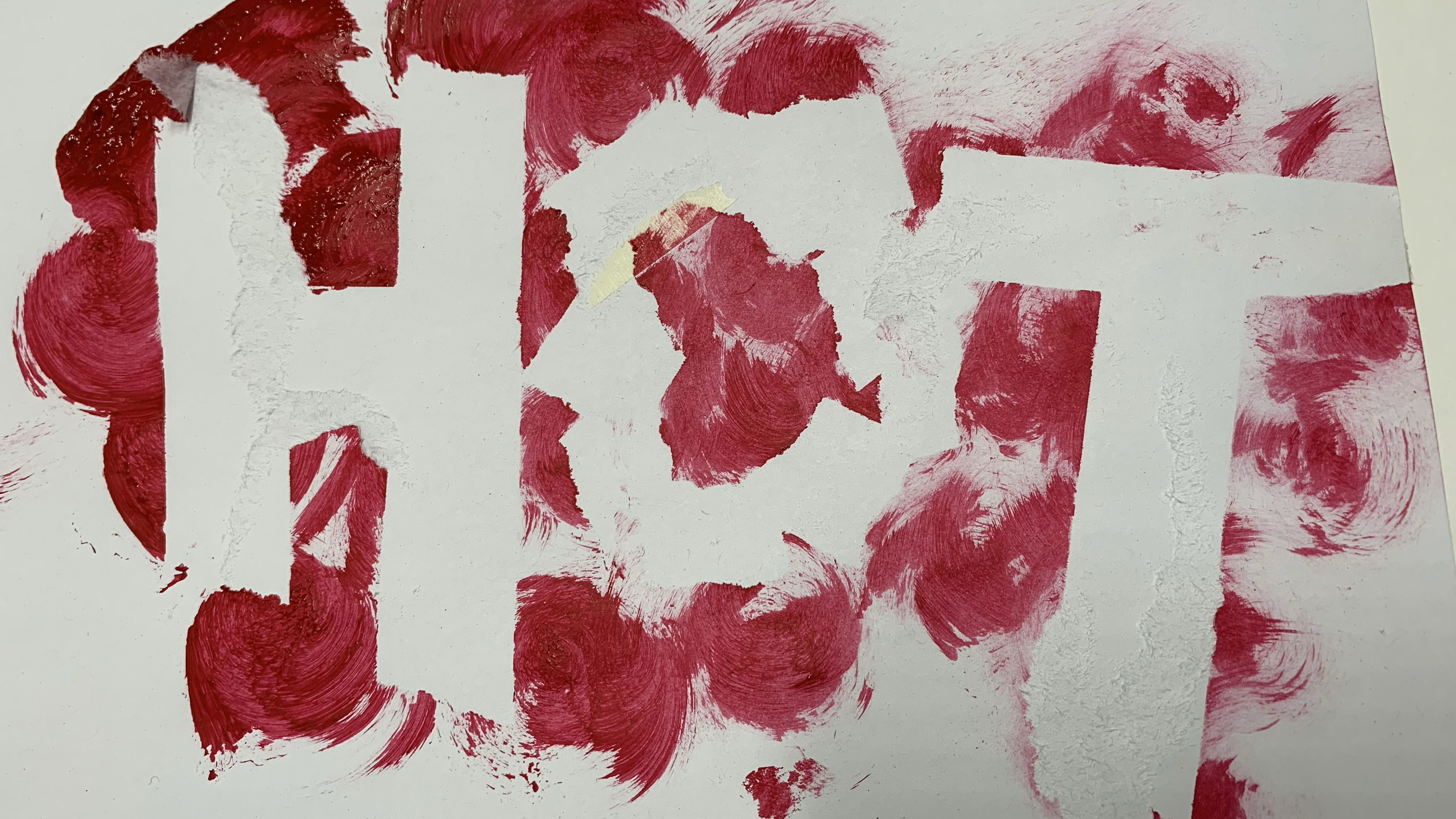 Several circular red brushstrokes, with sections stripped away from it to form the word "HOT".