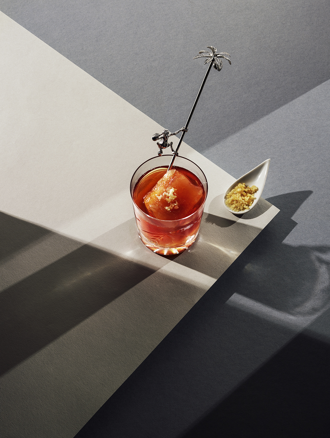 An amber-coloured cocktail in the sunlight