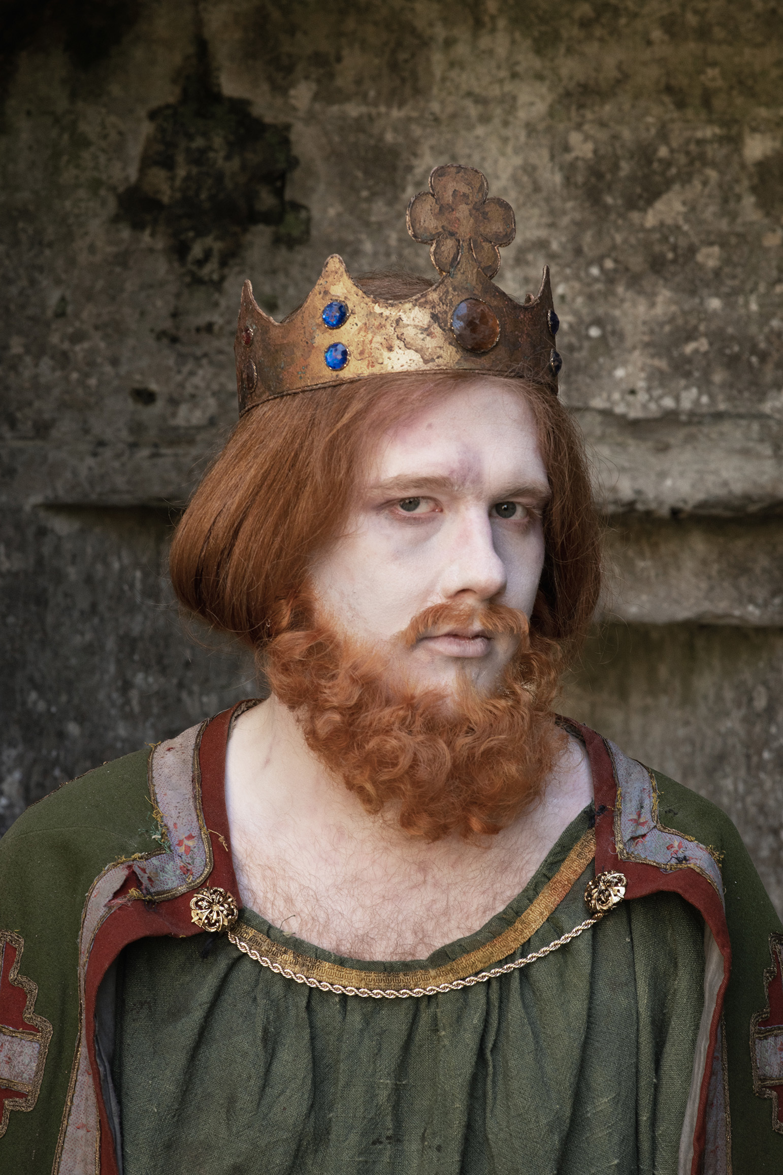 Actor playing Edward the second, posing at Corfe Castle as part of a collaboration between AUB alumna and the National Trust