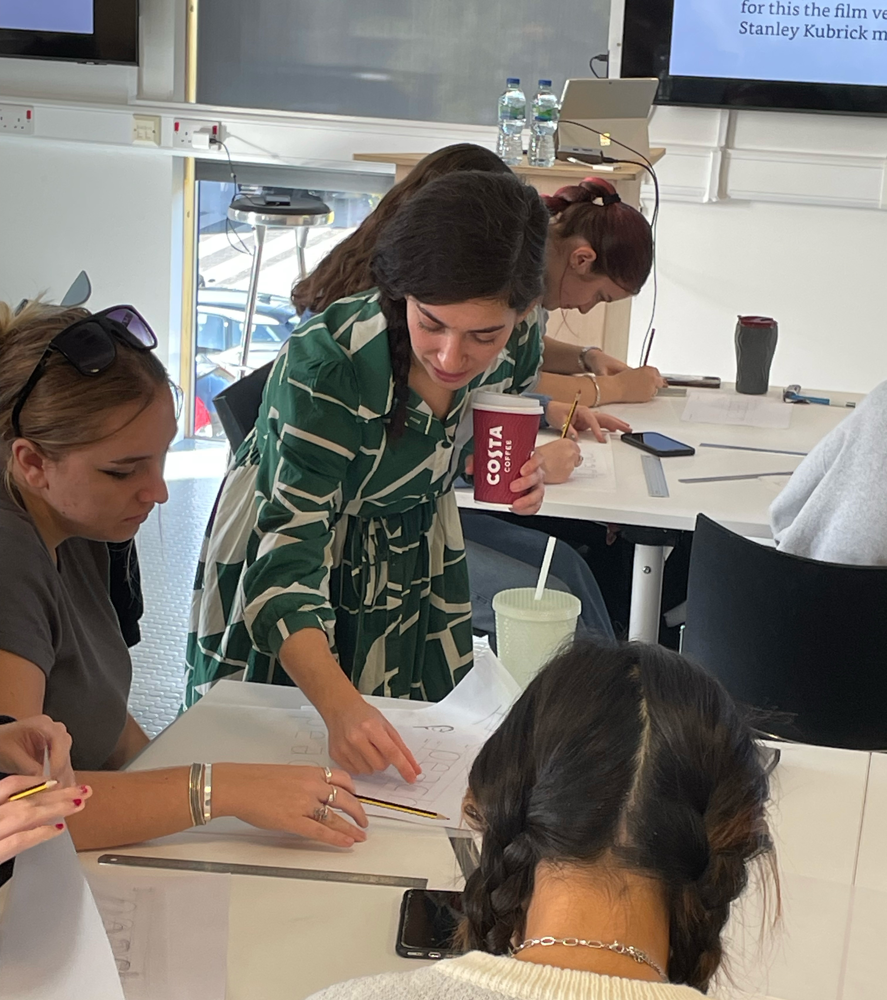Typographer E Beveratou working with BA (Hons) Graphic Design students on AUB campus.