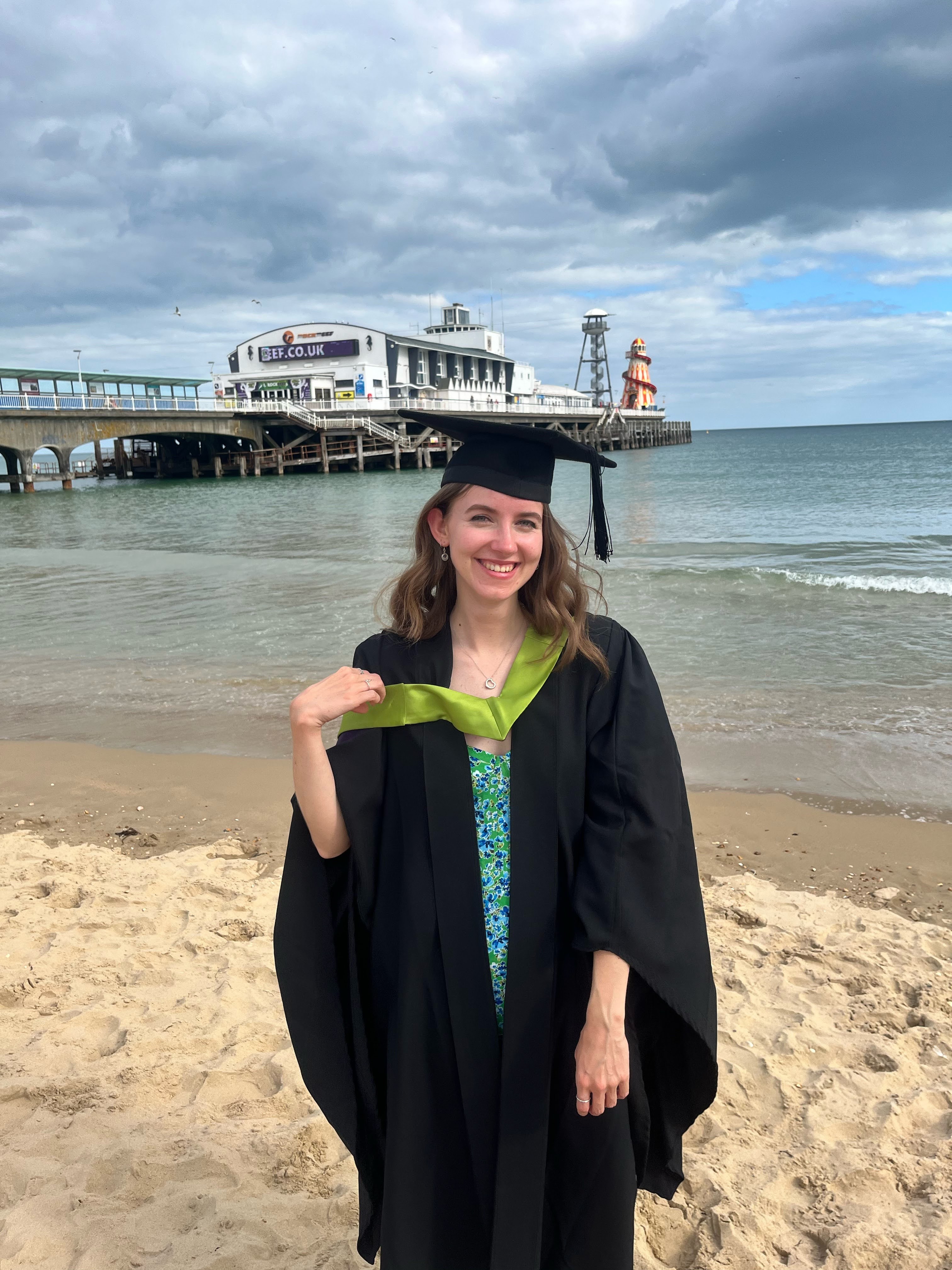 Ella Averty in graduation gown by Bournemouth Pier.