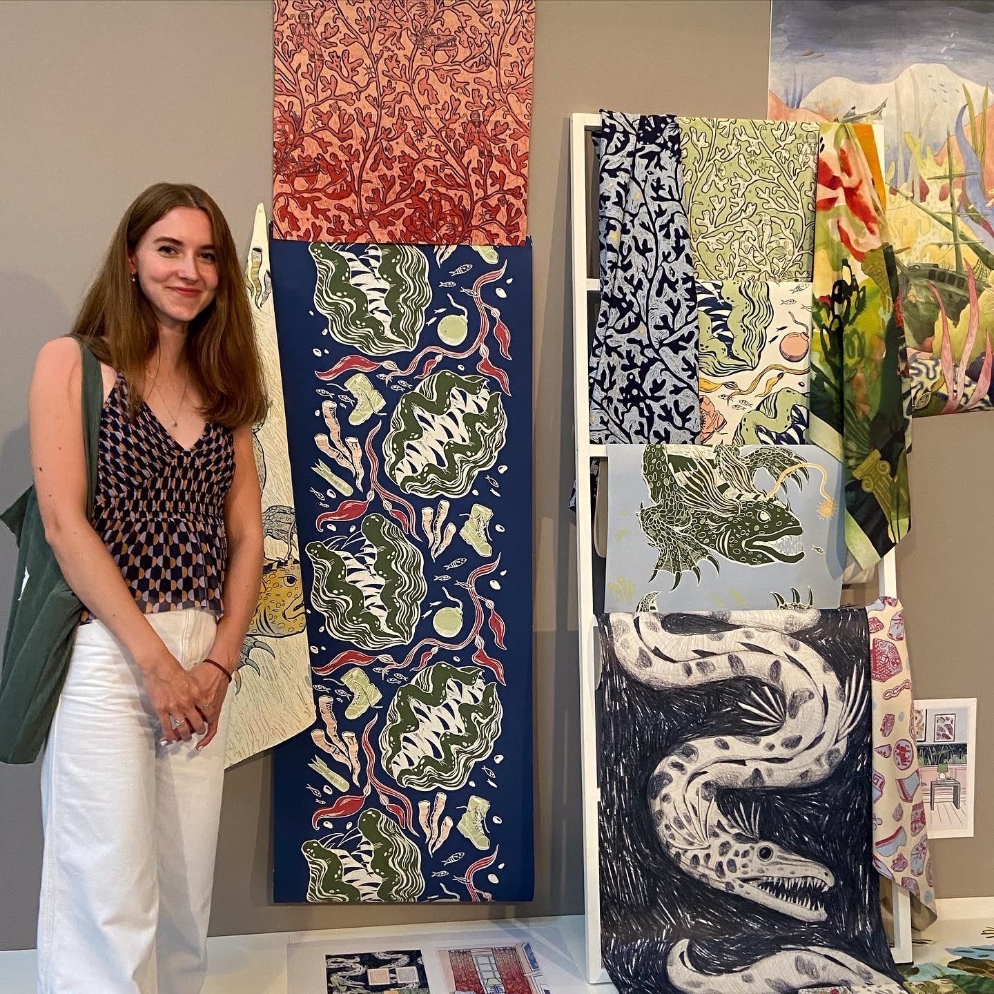 Ella Averty stood next to her textile creations, floral and oceanic patterns.