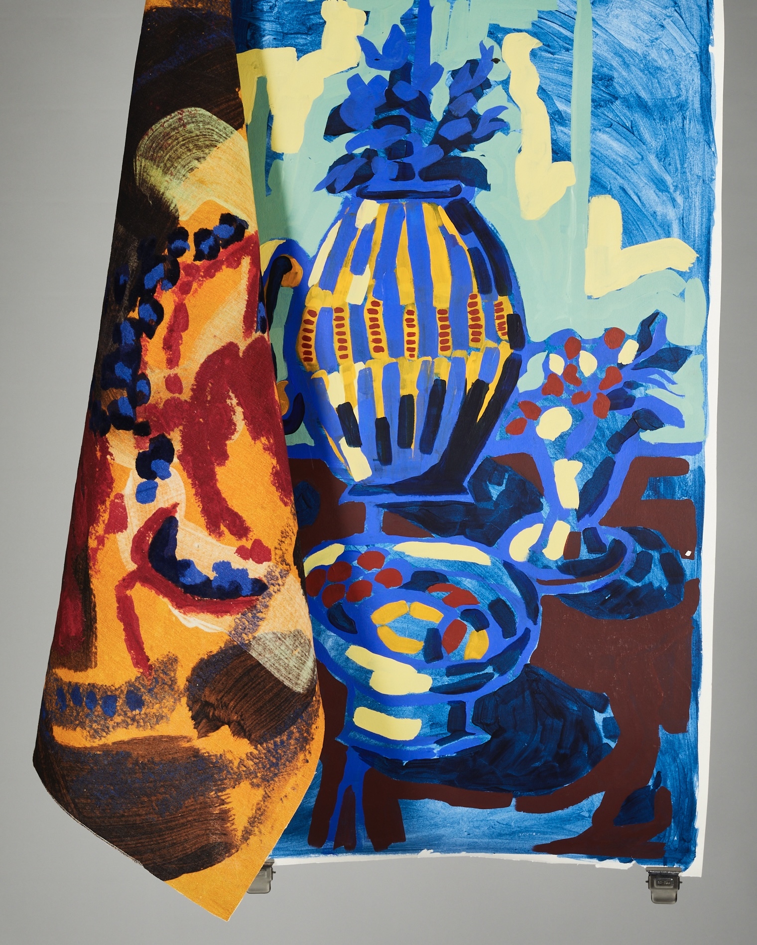 Colourful abstract textile work hanging on display.