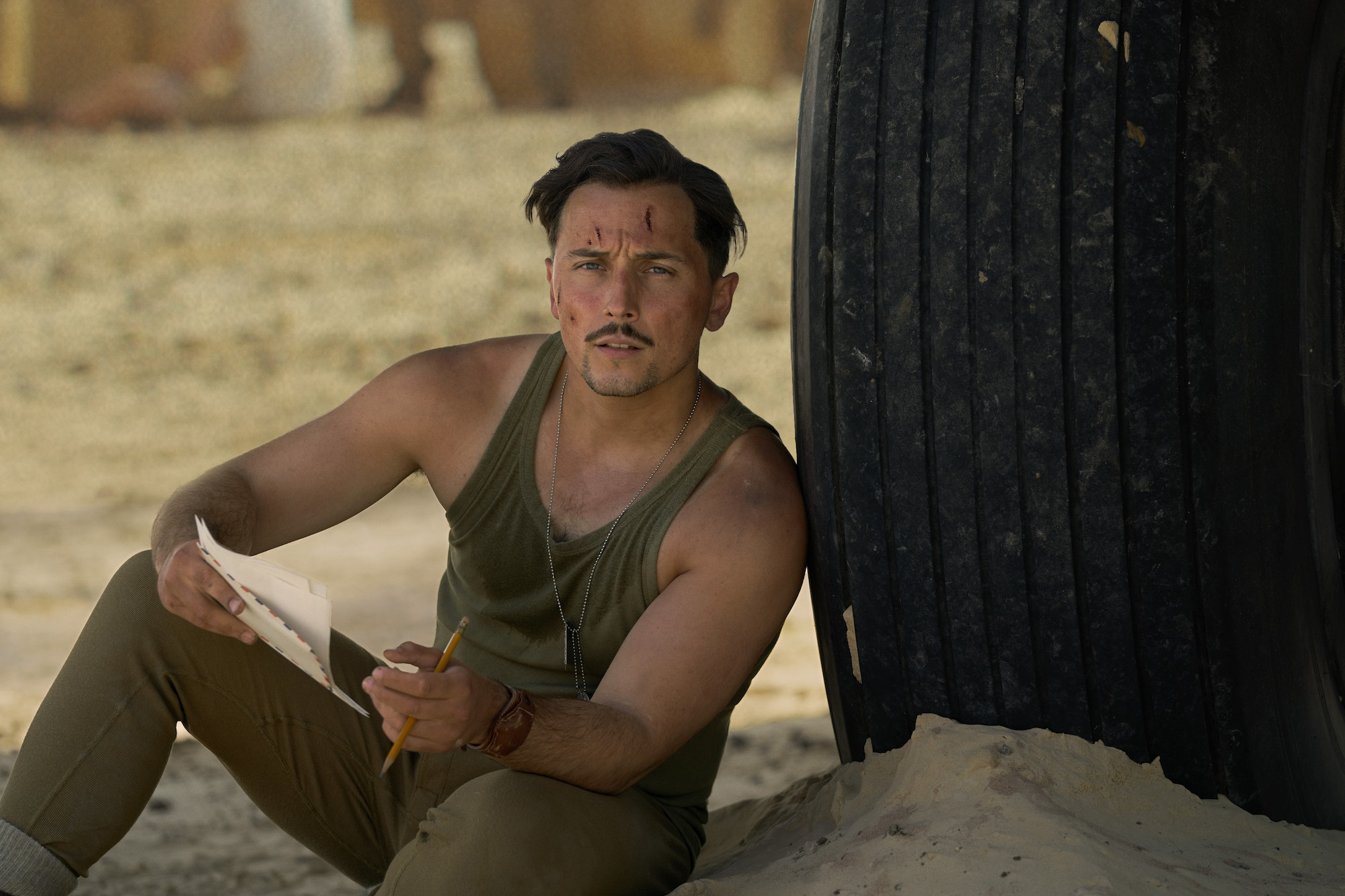 Still from the war drama series "Masters of the Air" showing actor Elliot Warren in character as Lt. James Douglass.