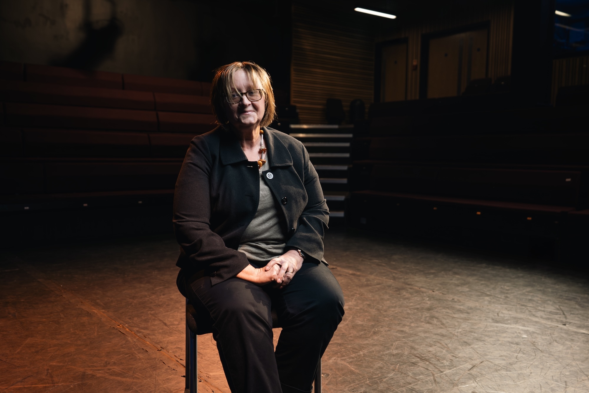 E McBain photographed while sitting in the Studio Theatre at Arts University Bournemouth.