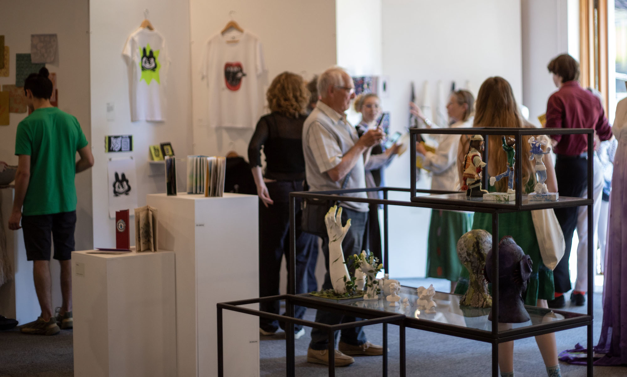 Several people looking at exhibits during the 2023 Foundation Summer Shows.