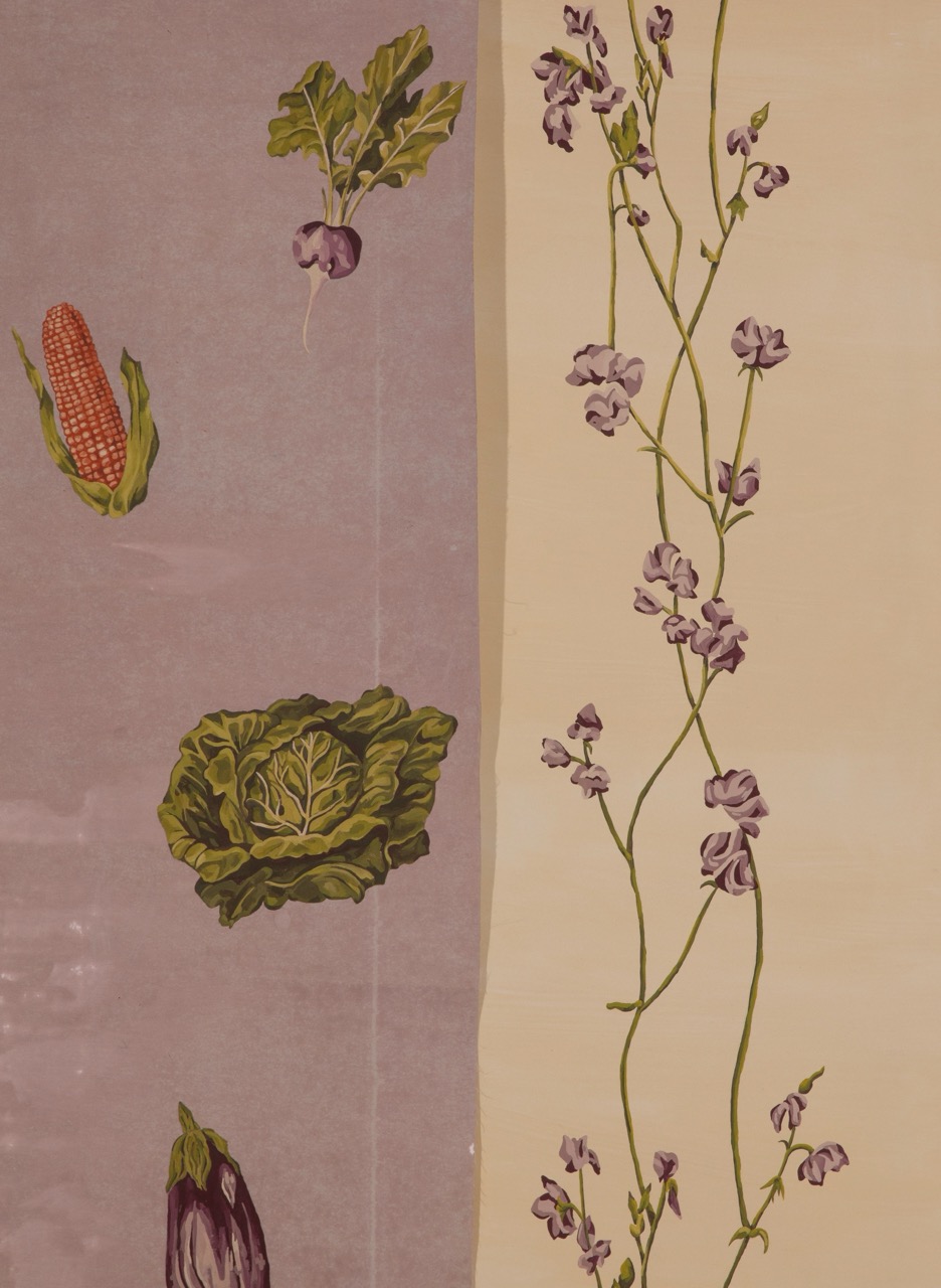 A decorative fabric featuring illustrations of vegetables, including corn, radishes, and cabbage, on a textured lilac background. On the right, delicate purple flowers are intertwined with green stems against a beige backdrop.