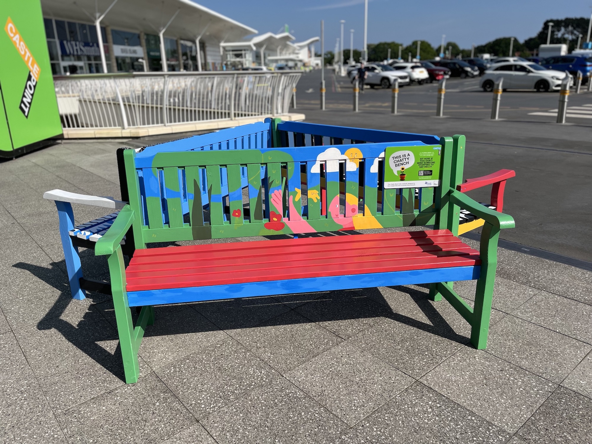 Three colourful "Chatty" benches arranged in a triangle by Castlepoint car park.