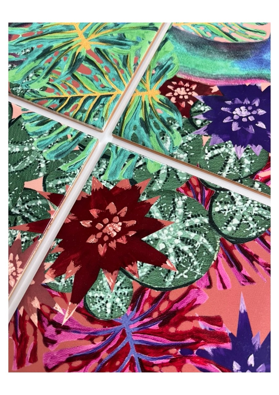 Colourful tropical leaf pattern divided by white grid lines. Green, pink, purple, and burgundy botanical shapes with radiating fronds.