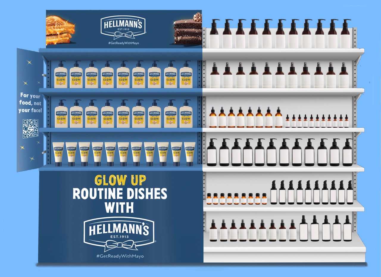 A retail display featuring multiple rows of Hellmann's mayonnaise bottles on a blue background. The left side has a promotional banner with text that reads 'Glow Up Routine Dishes with Hellmann's'.