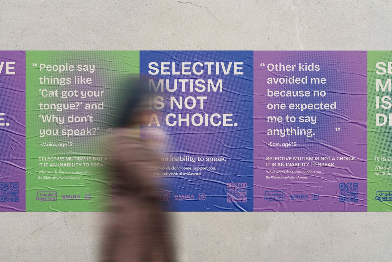 A blurred figure walks past a wall featuring several posters about selective mutism. The posters include quotes and explanations, with bold headings stating "SELECTIVE MUTISM IS NOT A CHOICE" and descriptions of the condition.