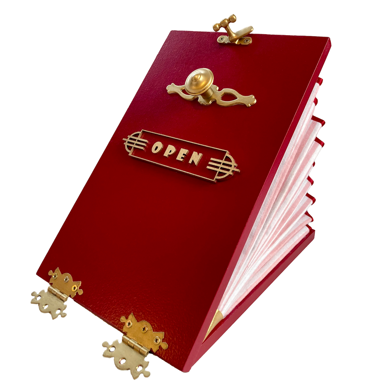 A primarily red model compartment with gold hinges and handle, and the word "Open" on the front, lying partly open on a plain surface.