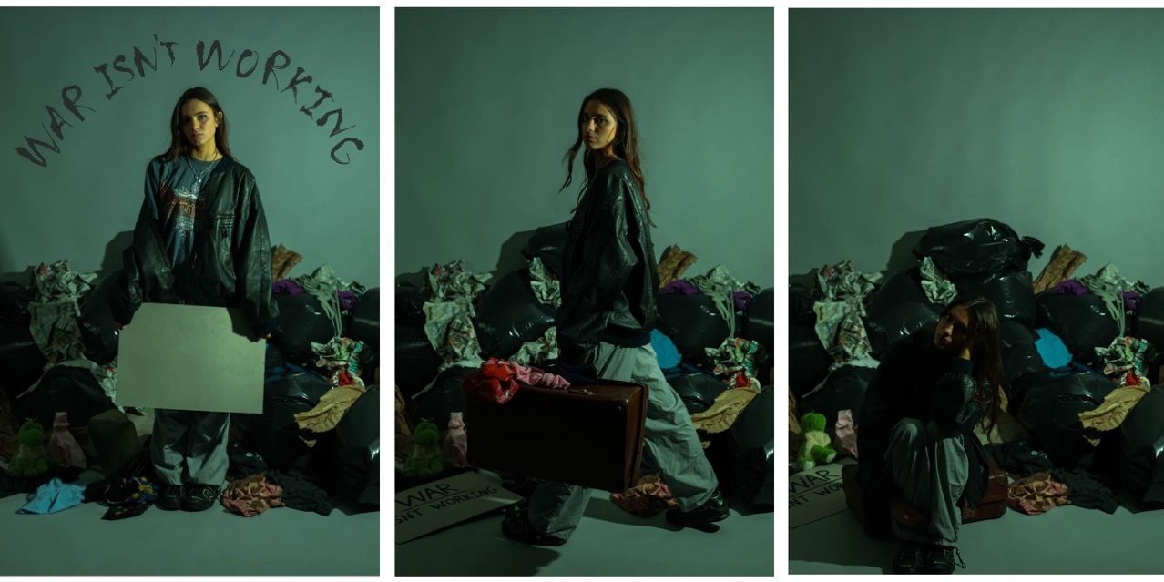 Three split images of a woman wearing leather under green light in front of a pile of clothes, text on wall reads 'war isn't working'.