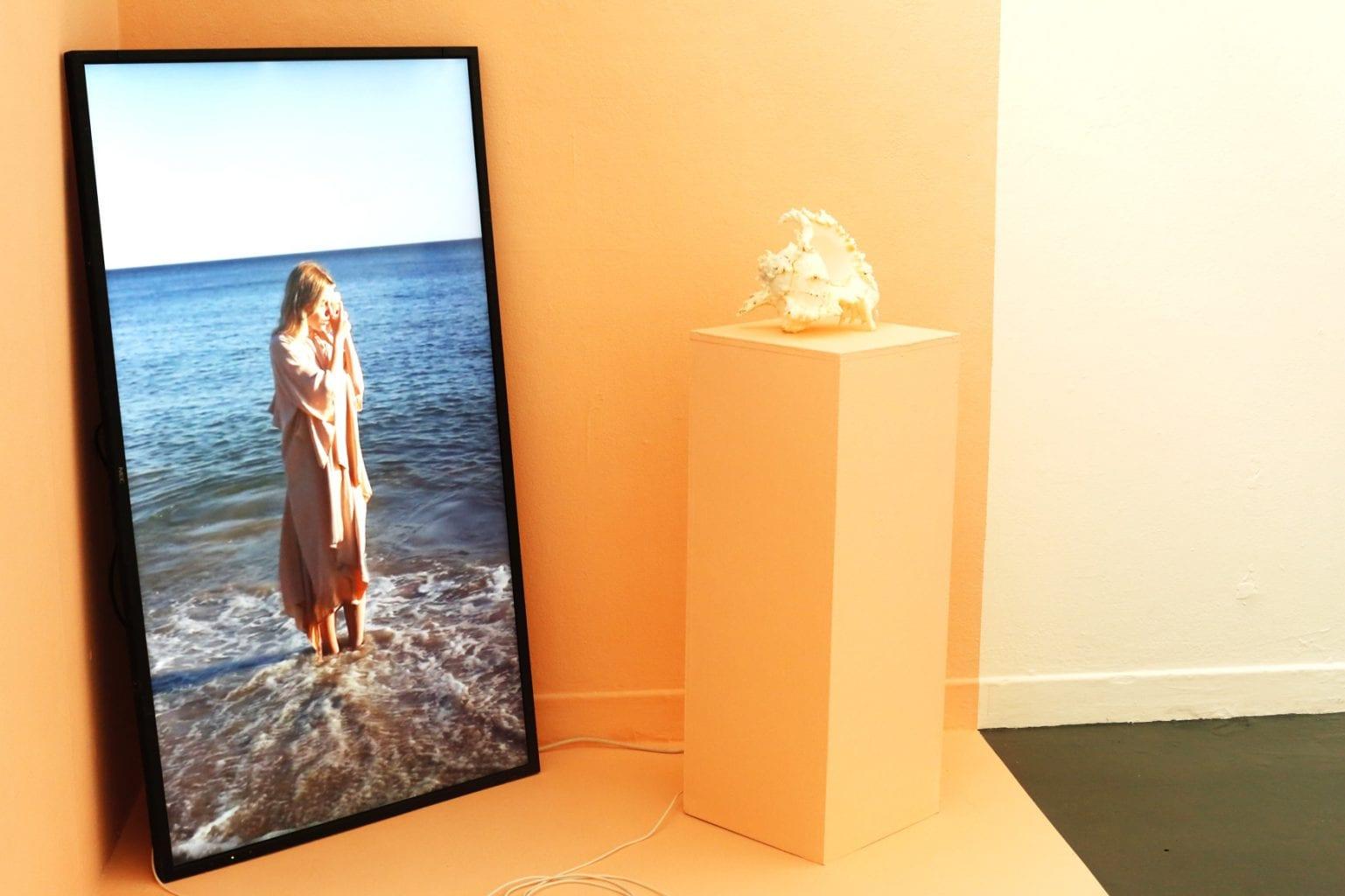 Picture of a lady on a beach on the floor