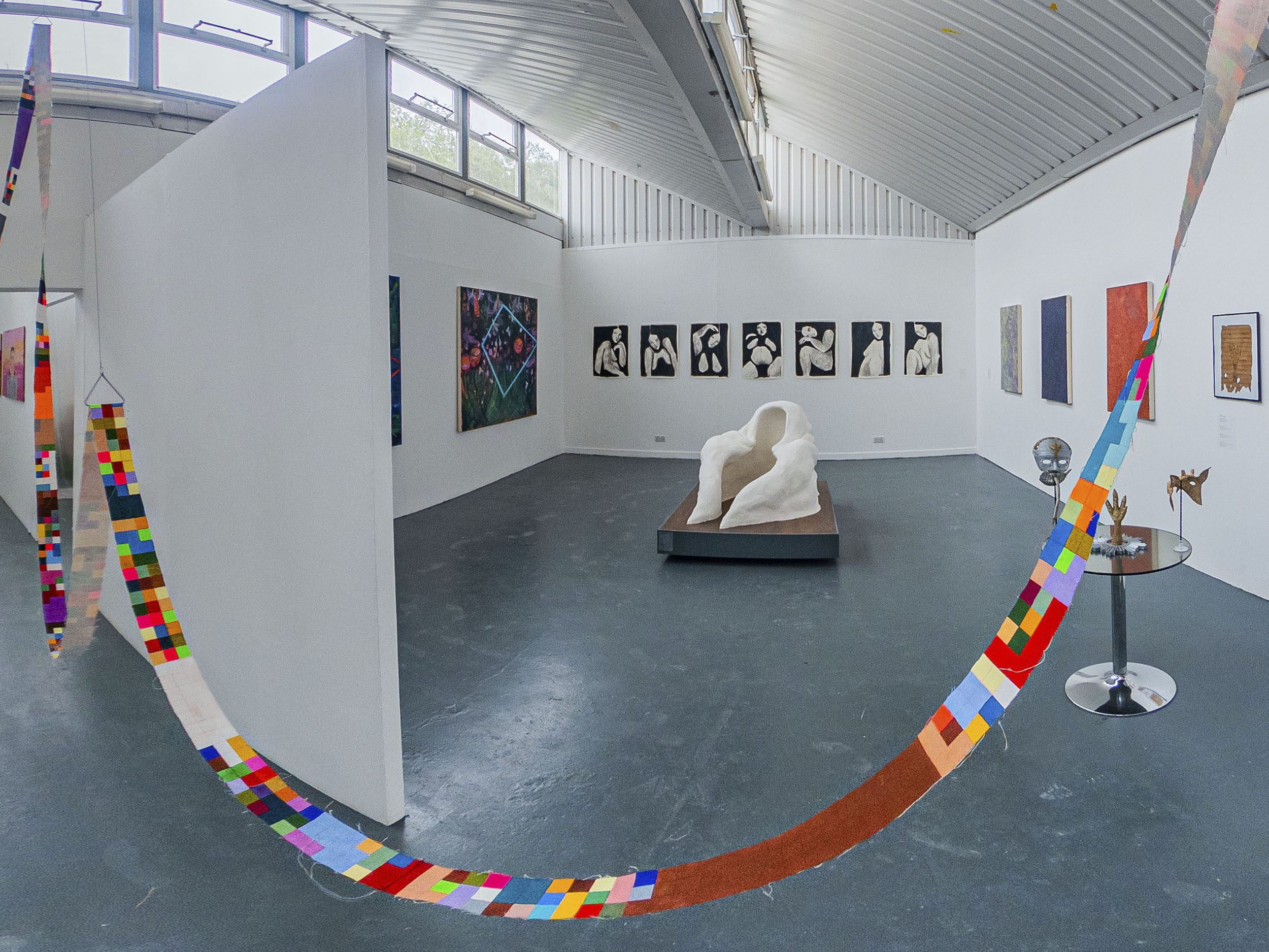 Panoramic image of the fine art studios including the work in the studio