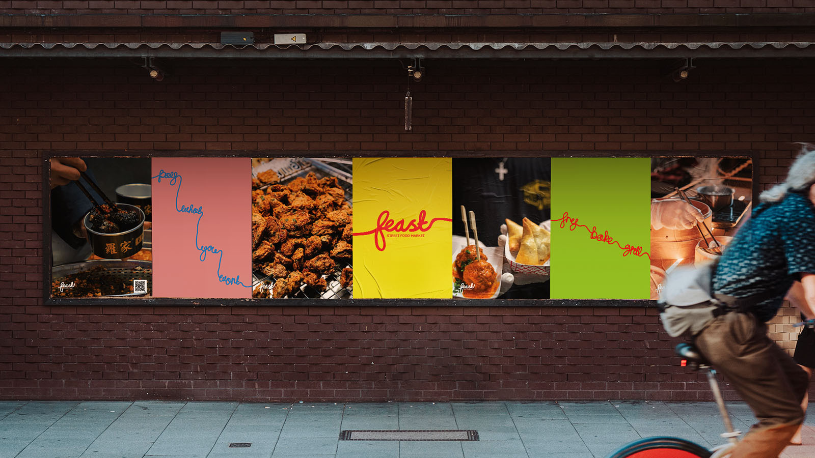 Row of colourful food advertisements on brick wall including pink, yellow, black, and green posters with food imagery and text.