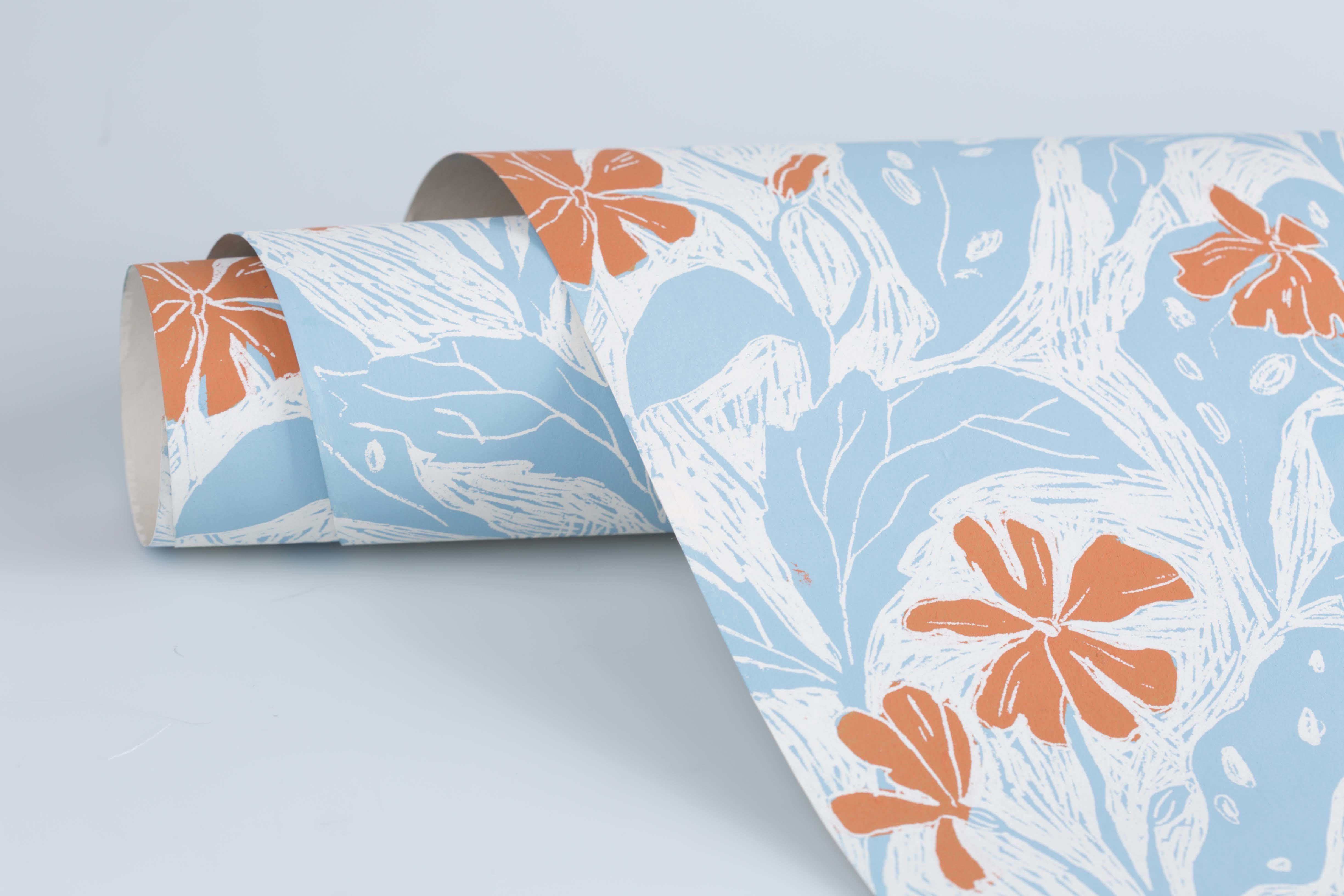 Wallpaper wrap with floral light blue and orange patterns.