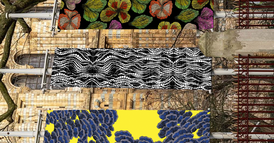 Three fabric panels displayed on wooden surface: floral hibiscus pattern, black and white zigzag mosaic design, yellow with blue grape clusters.