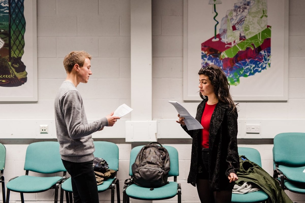 Two Actors reading their scripts