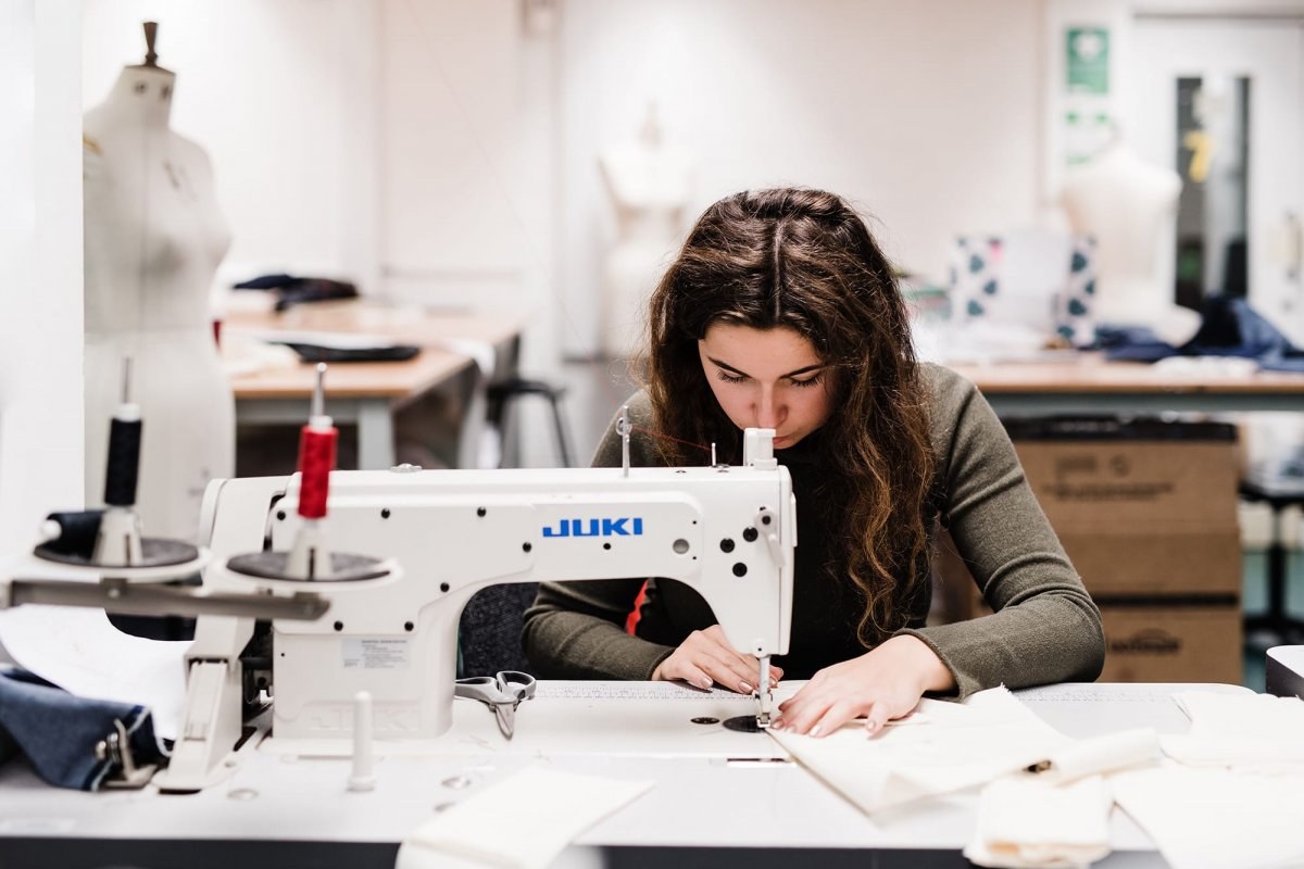 Student using a sewing machine