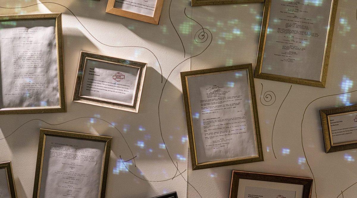 Series of frames on a wall containing different scripts