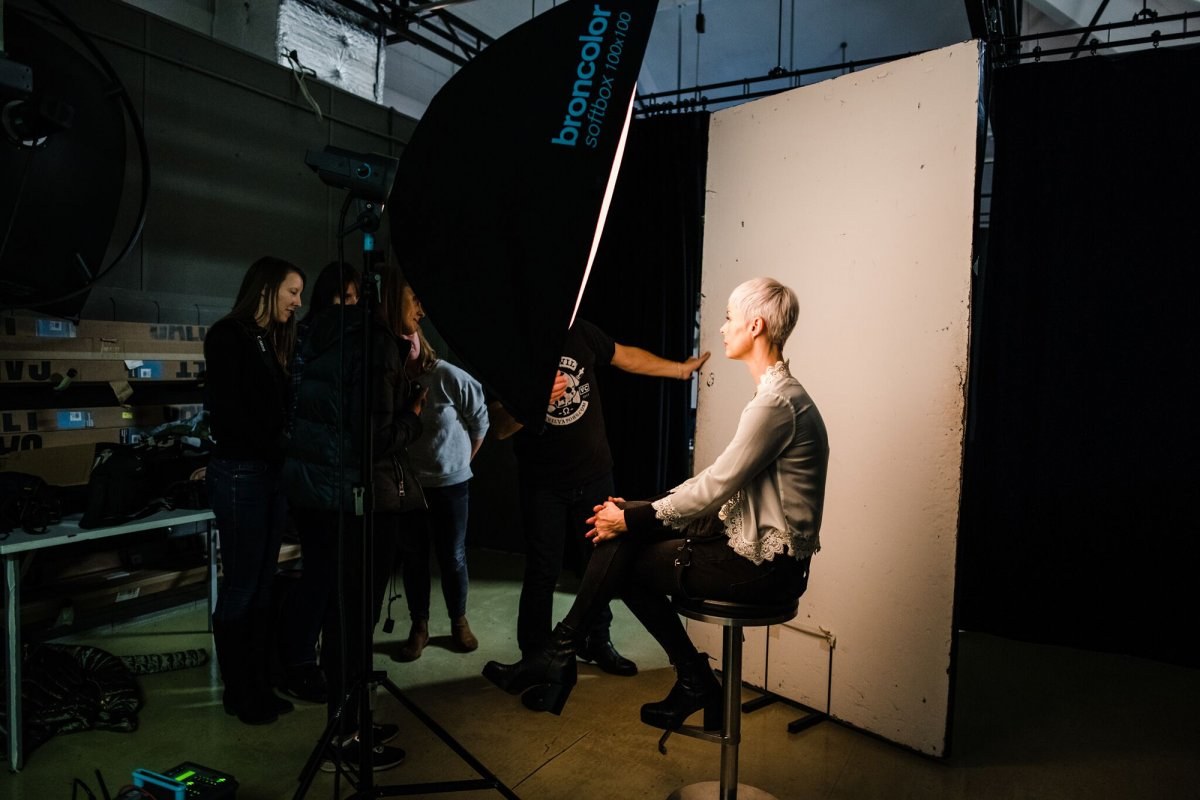 Students learning about how to light a subject