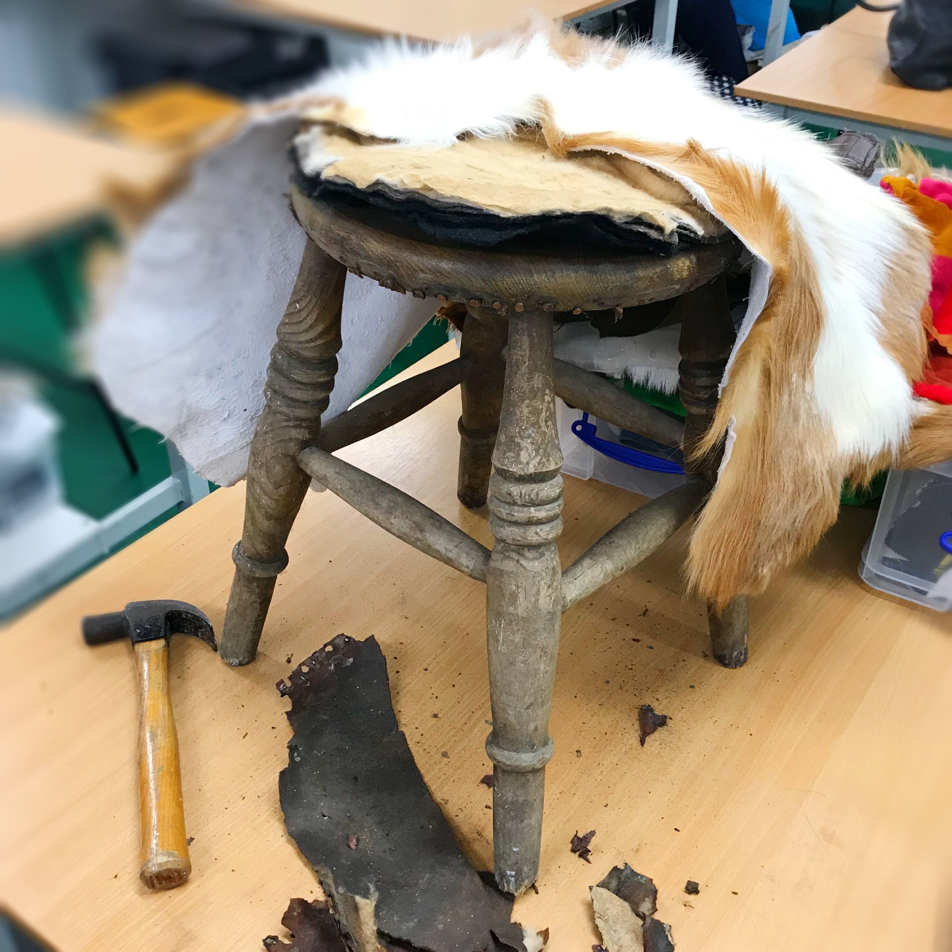 Leather draped over a stool