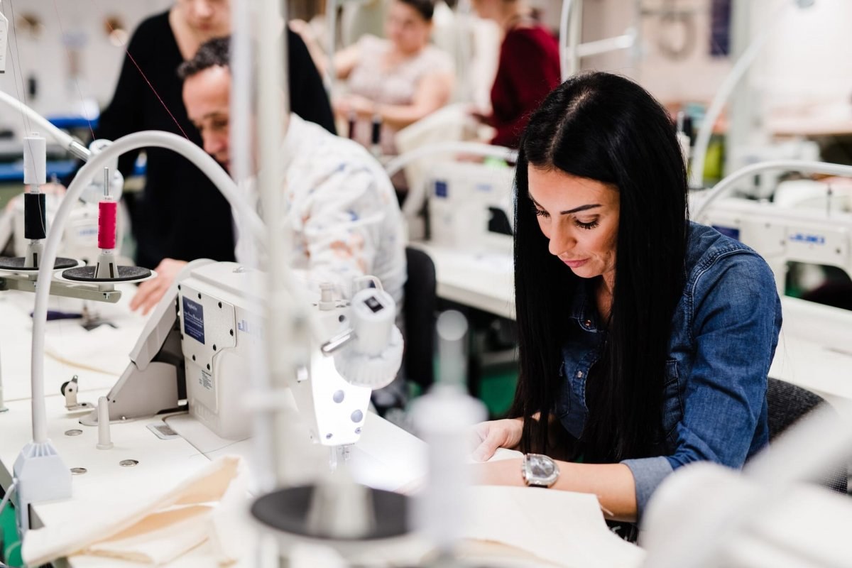 Image of a women using a sewing machine