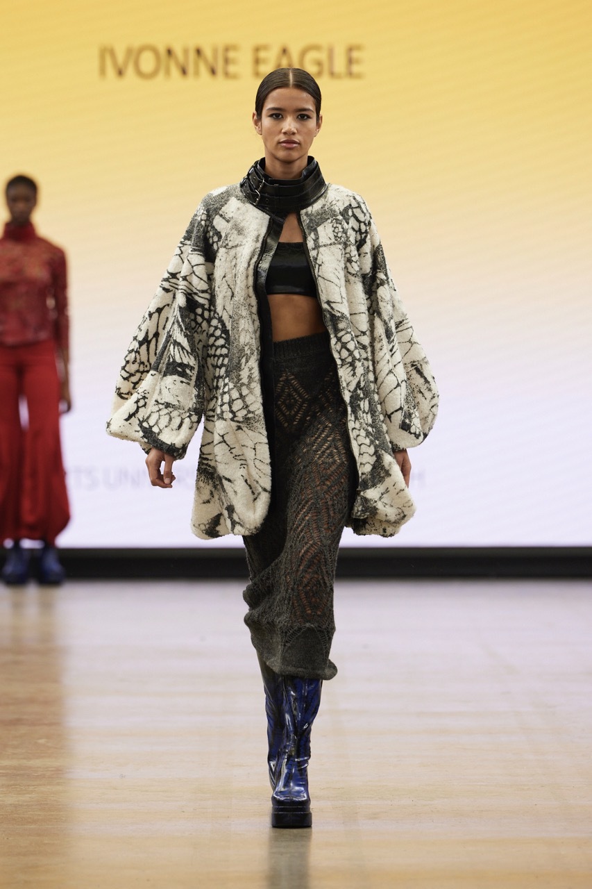 A student model strutting down the catwalk for Graduate Fashion Week 2023