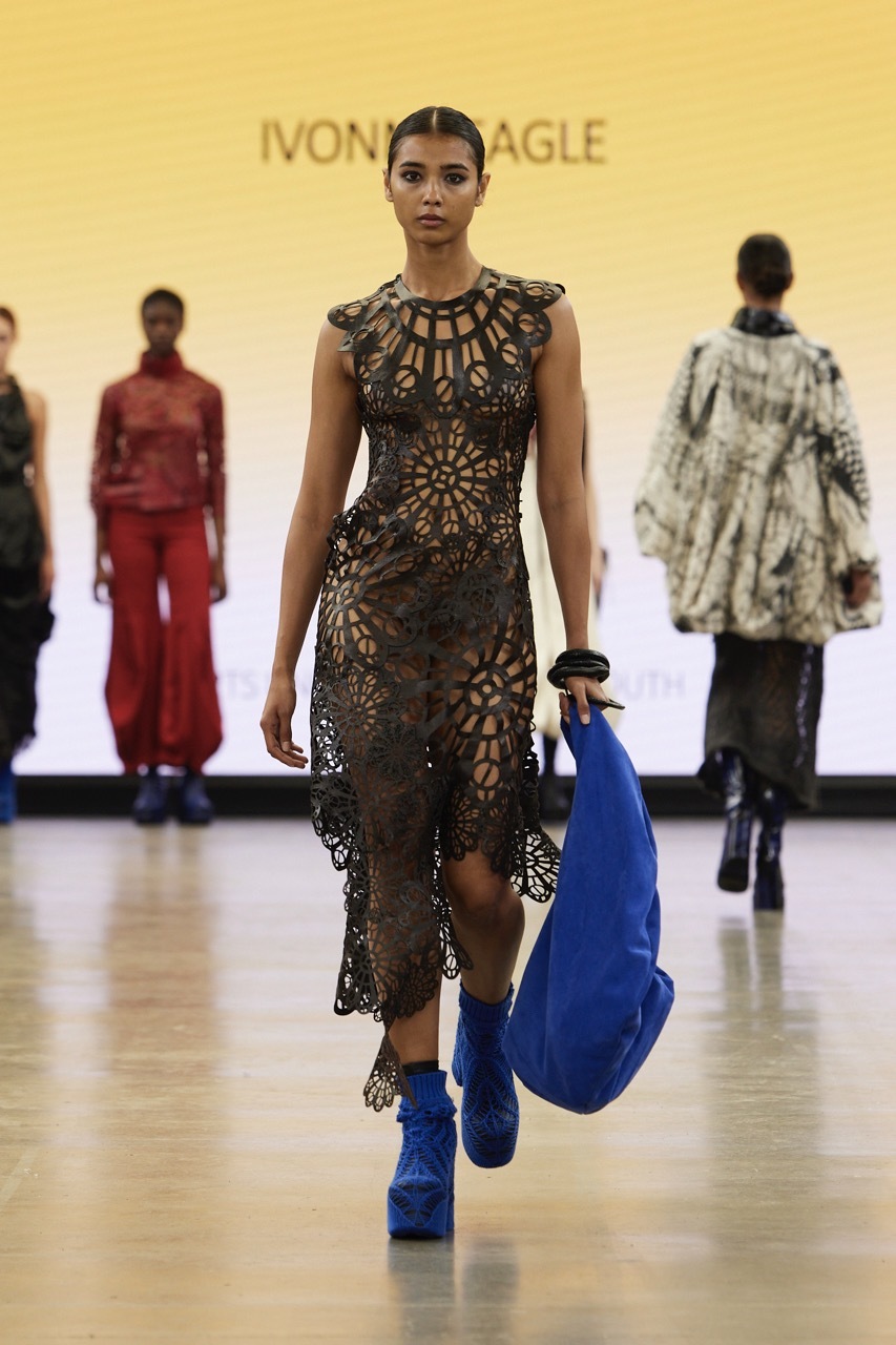 A student model strutting down the catwalk for Graduate Fashion Week 2023