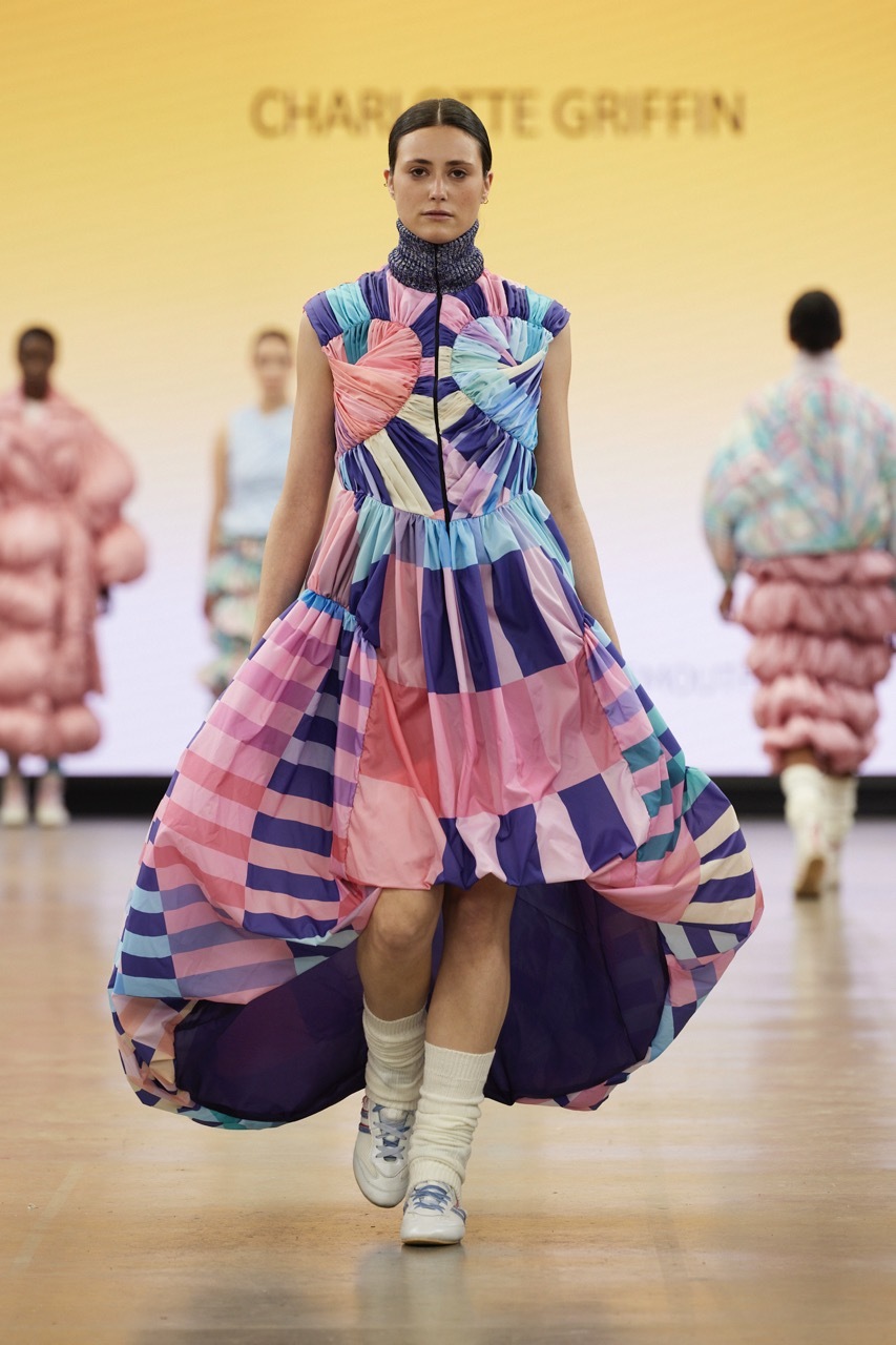A student model strutting down the catwalk for Graduate Fashion Week 2023