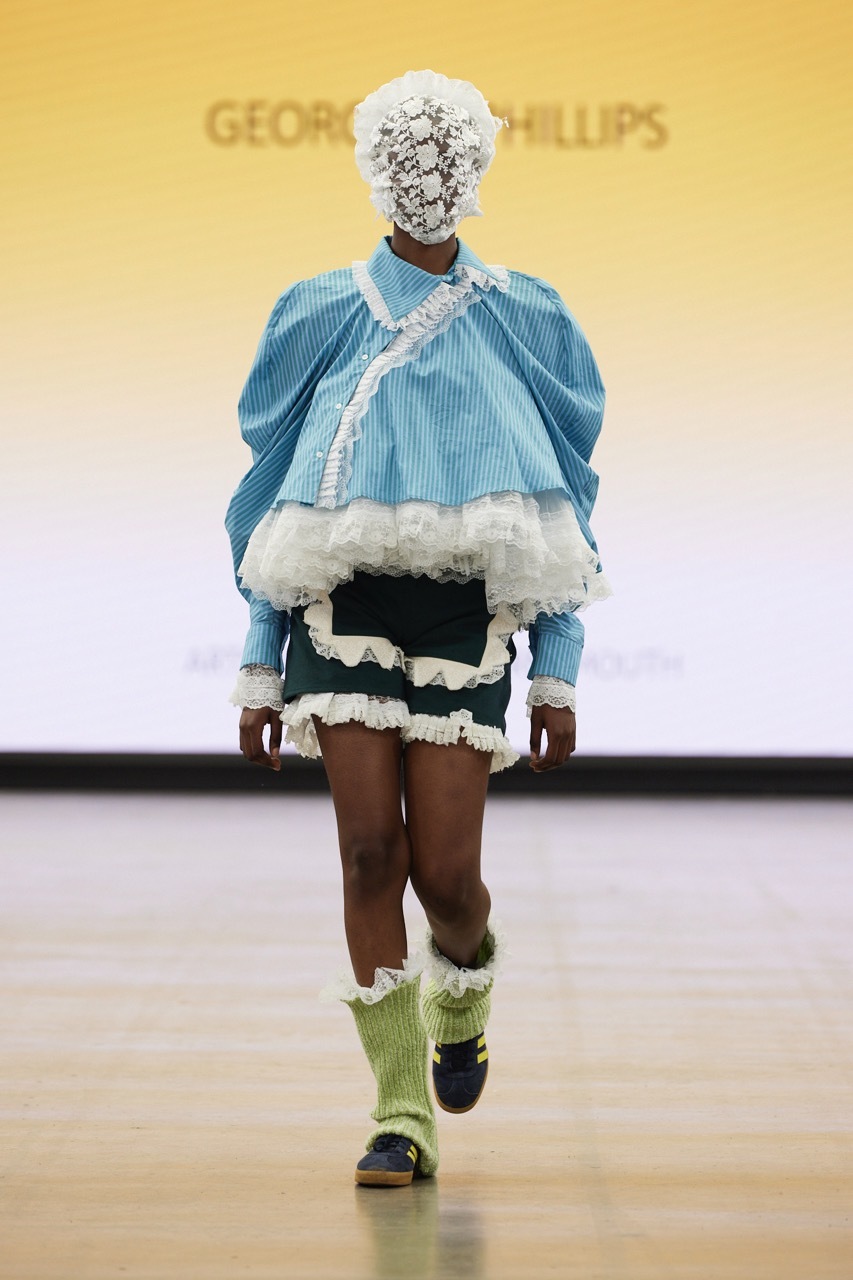 A student model strutting down the catwalk for Graduate Fashion Week 2023