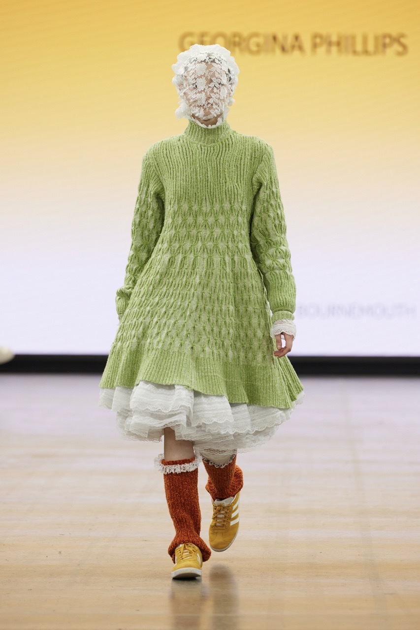 A student model strutting down the catwalk for Graduate Fashion Week 2023
