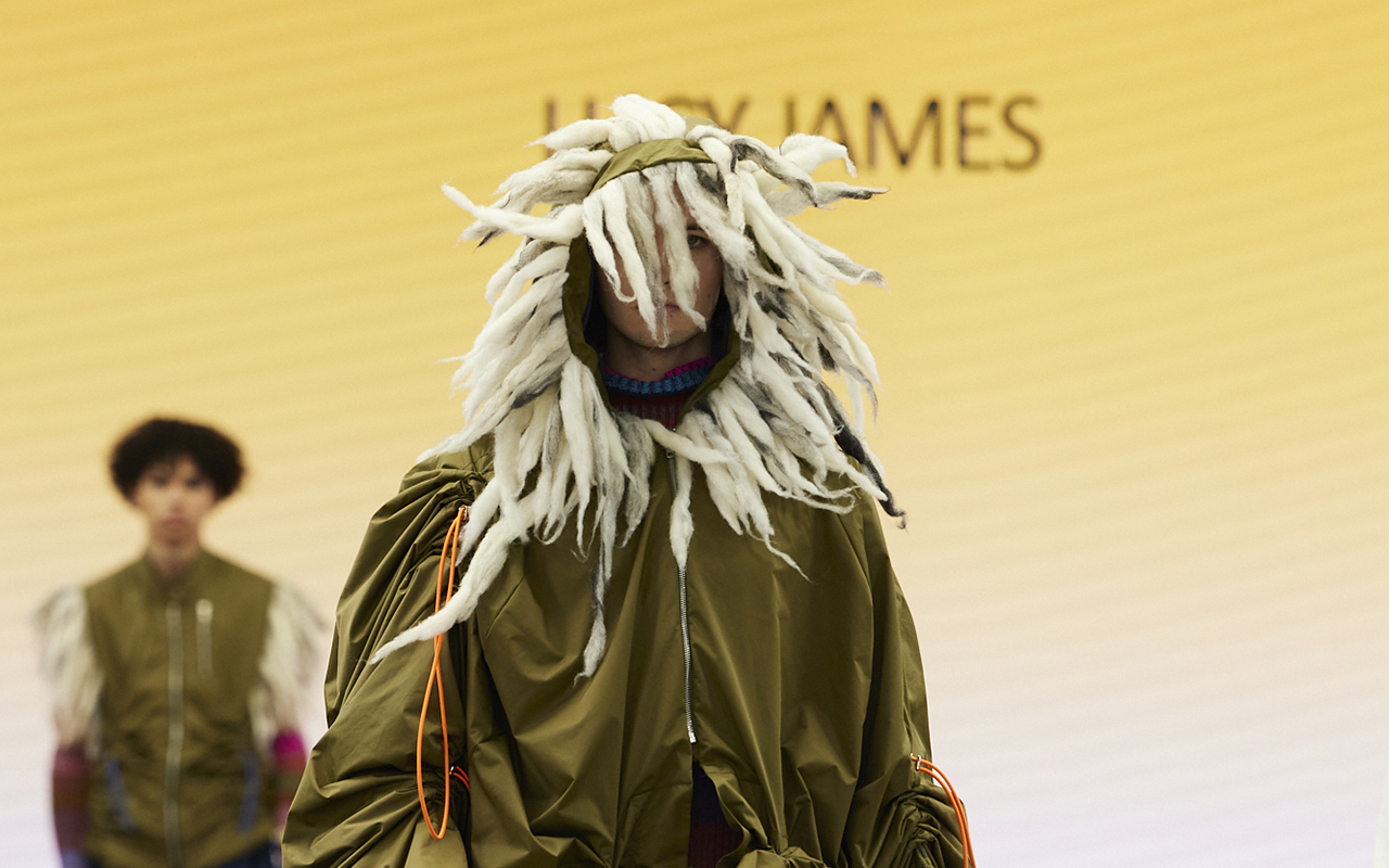 A model wearing a styled coat headpiece from Graduate Fashion Week 2023