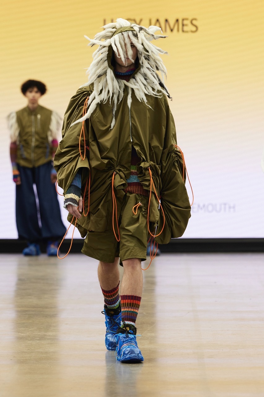 A student model strutting down the catwalk for Graduate Fashion Week 2023