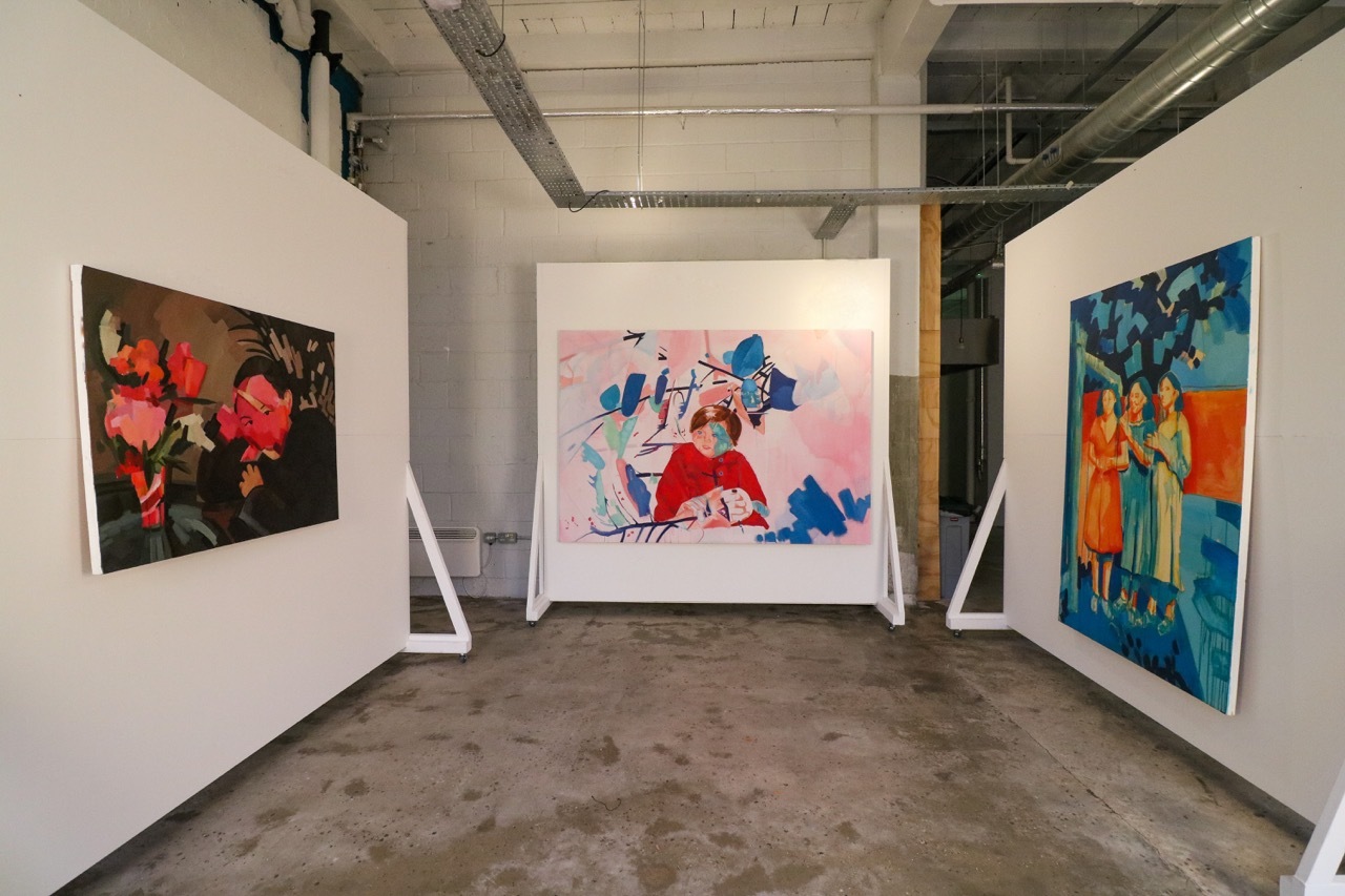 Gallery showcasing Liz Walker's artwork, colourful, white walls.