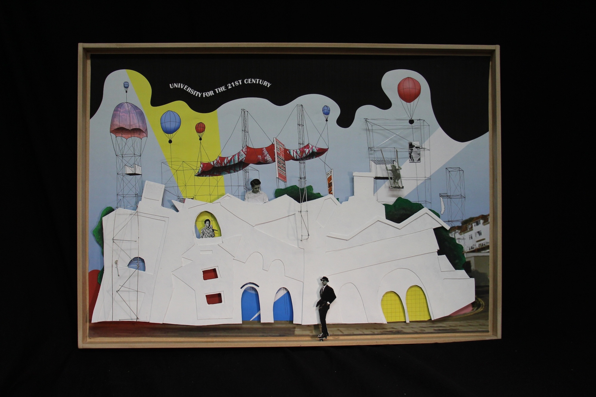 Framed mixed-media artwork with white architectural forms, yellow and blue shapes, small human figures, and collaged elements on light background.