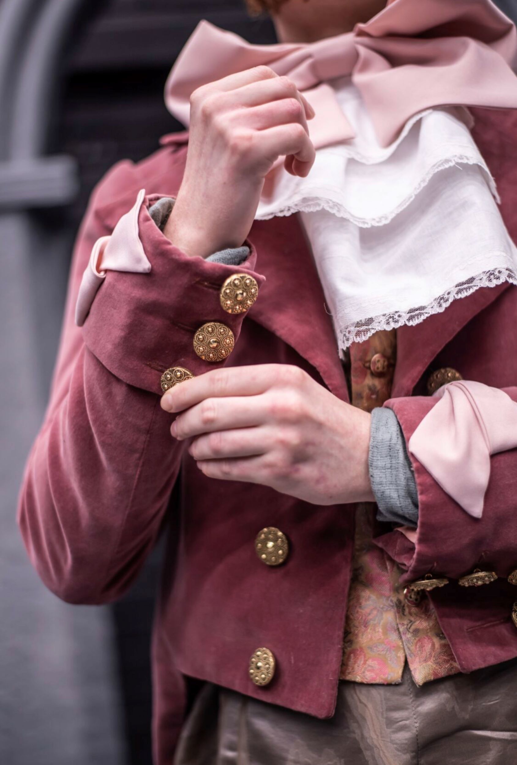 Close up of Mr Willoughby’s Pink velvet jacket cuffs and buttons.