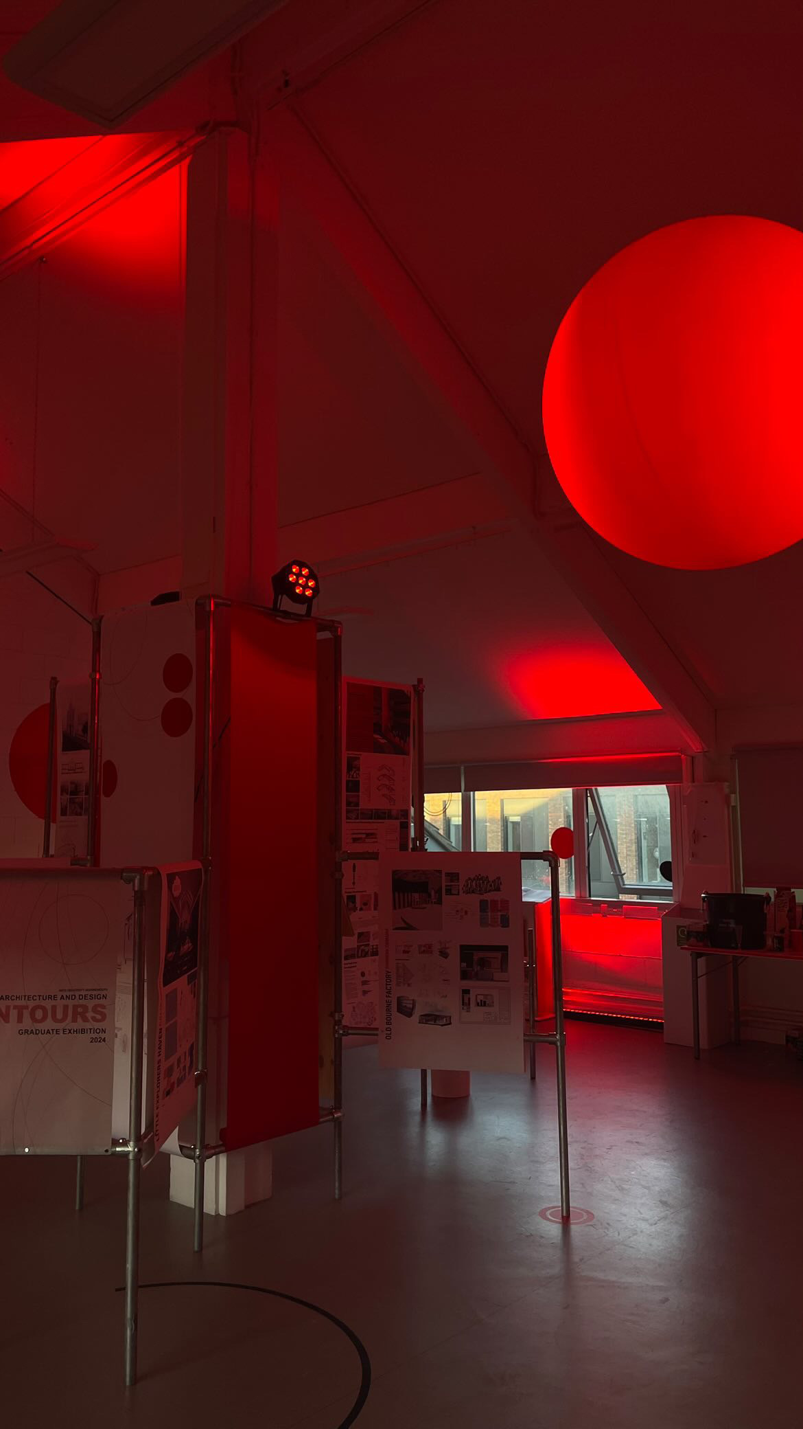 Interior Architecture and Design Graduate space, with red lighting created by Oliver Dewes.