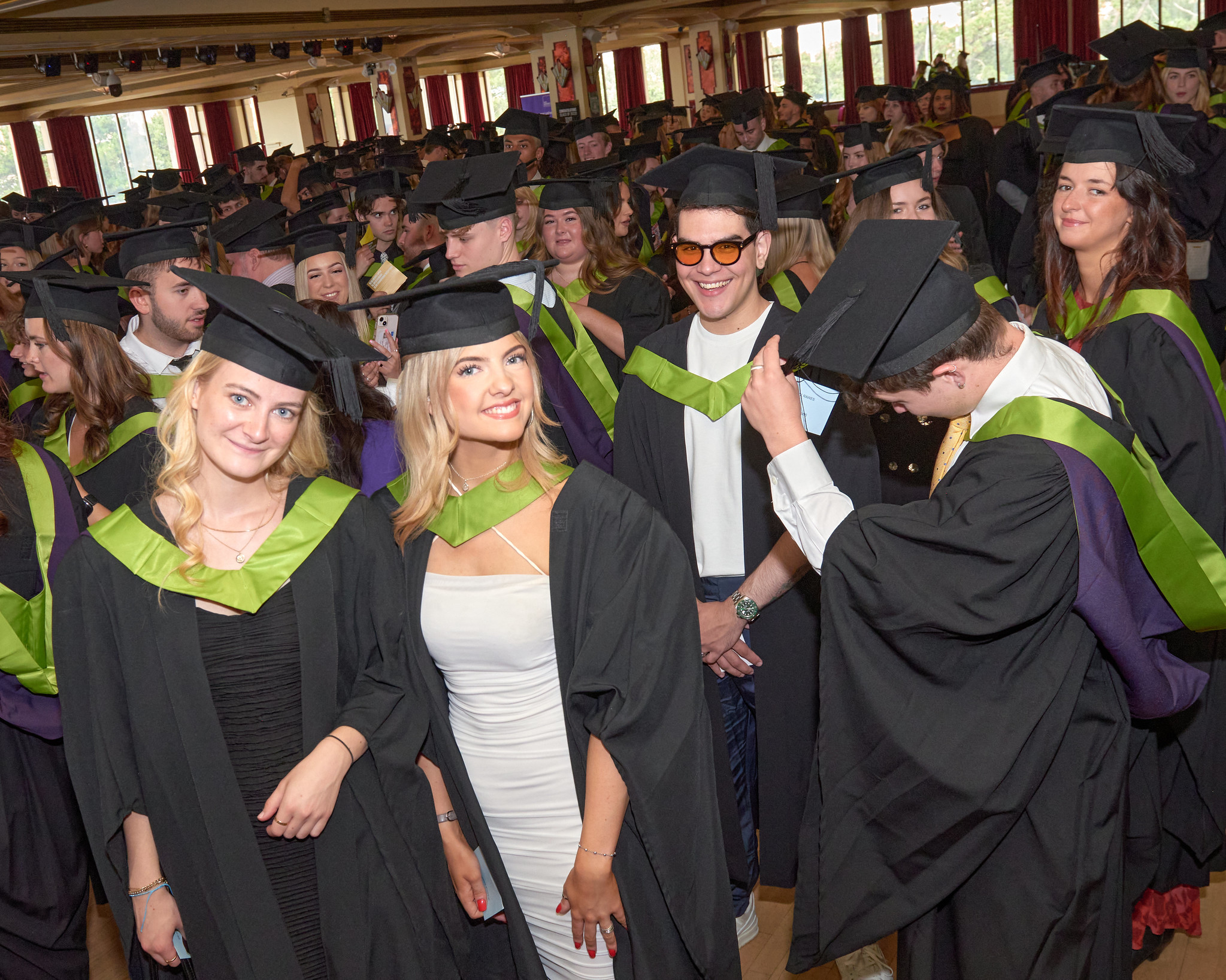 AUB students in graduation dress in the ballroom at the Pavilion at the 2023 graduation ceremony.