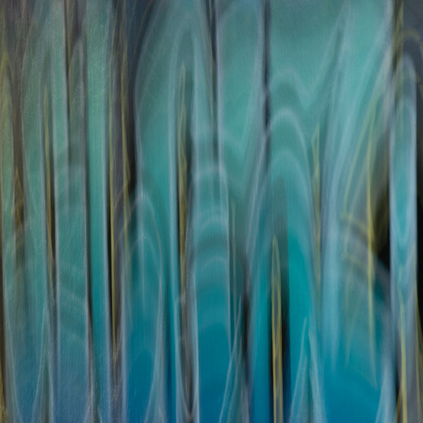 Abstract vertical streaks in teal, turquoise, and grey with blurred, flowing lines creating a soft, watercolour-like effect.