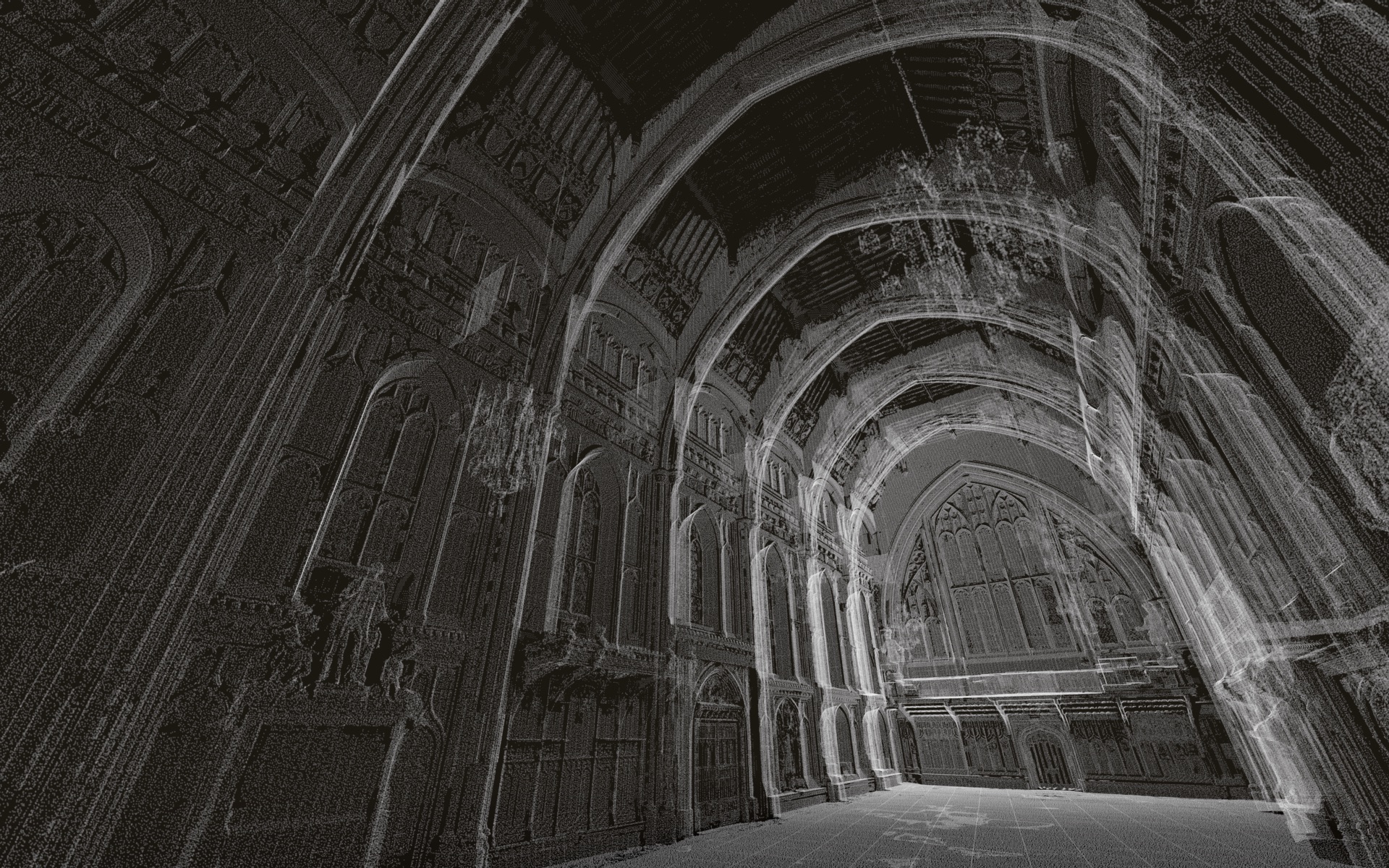 A Gothic cathedral interior with tall ribbed arches and carved stone columns, lit by shafts of light across the empty nave.