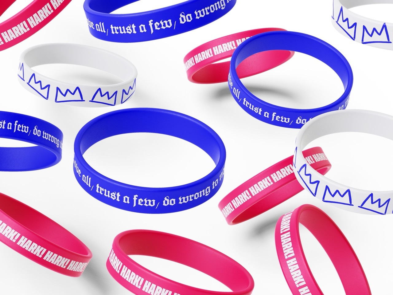 Blue, pink and white wristbands with Shakespearian-style quotes on them, white background.