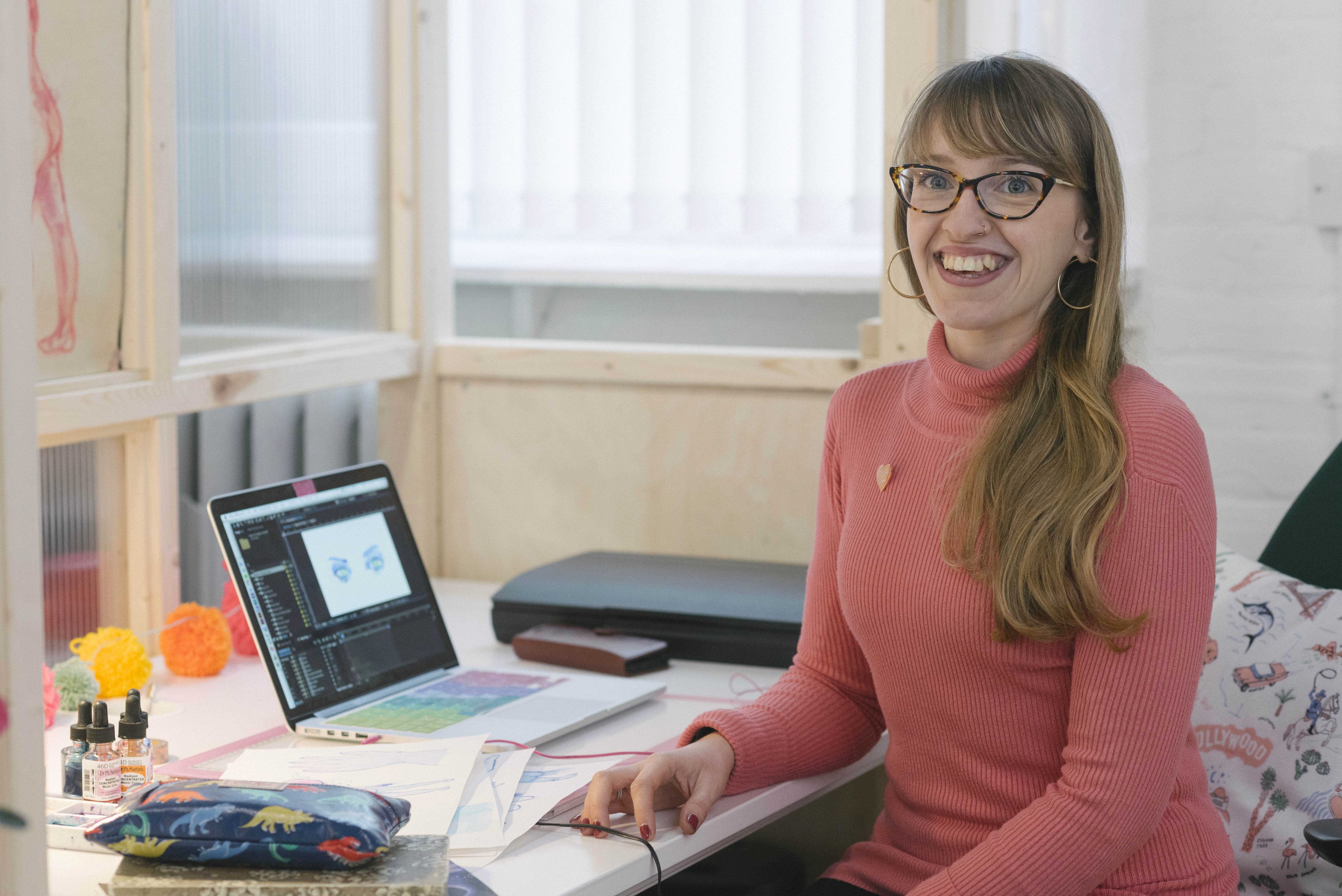 Corrianna Clarke sitting at her desk