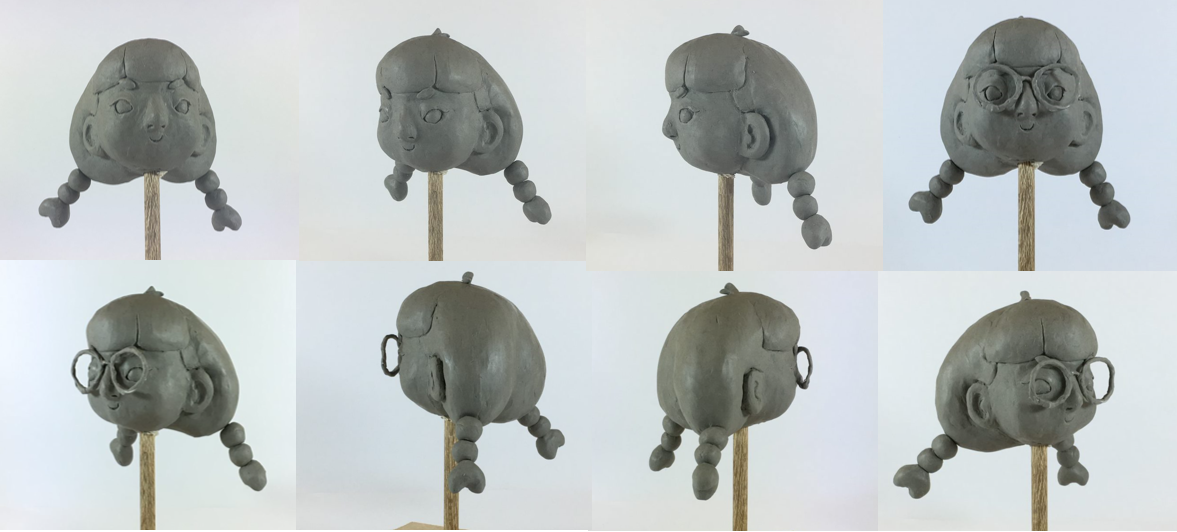 Clay model of the head of a cartoon character with pigtails and glasses viewed from eight different angles.