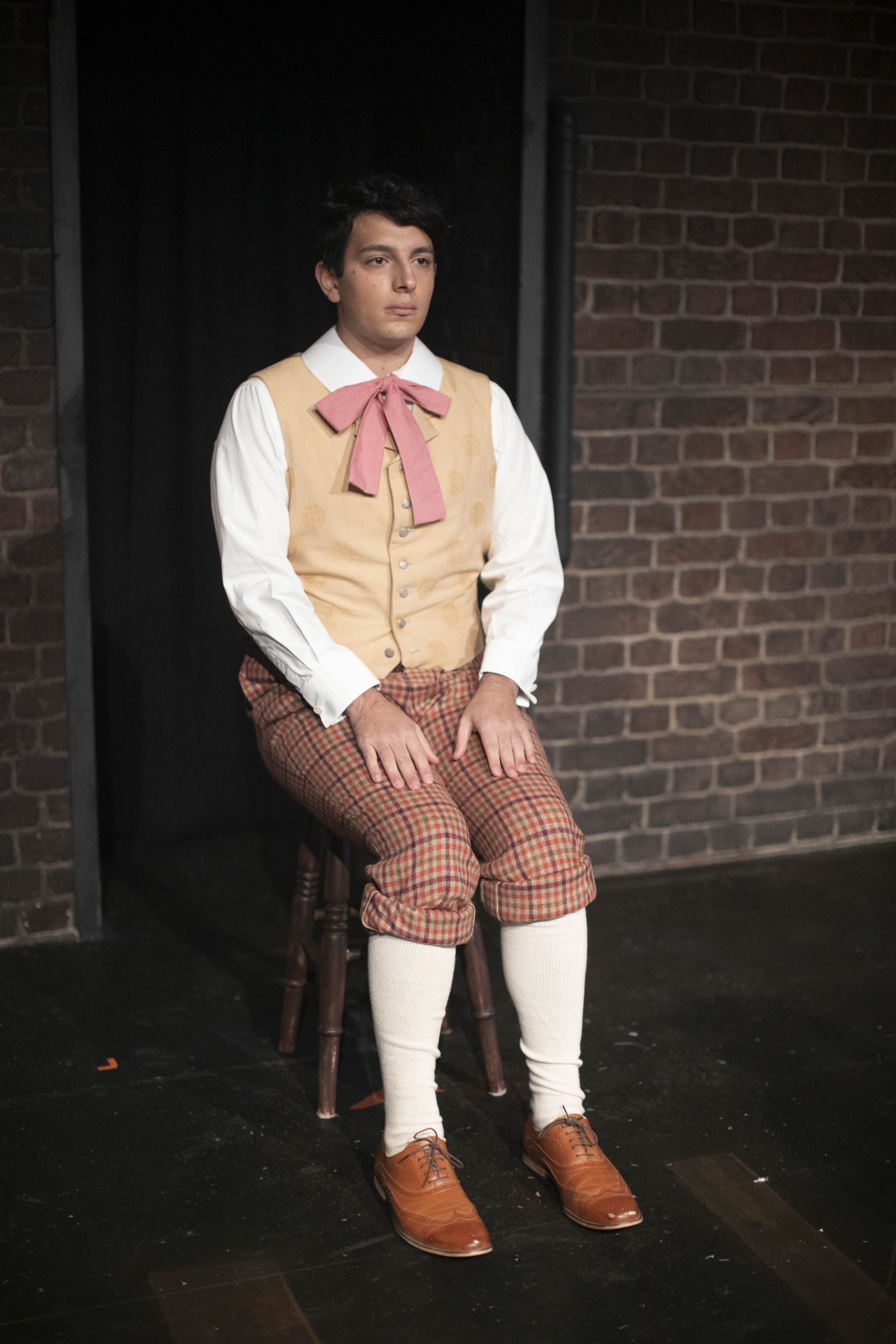 Students acting in a production of Hard Times
