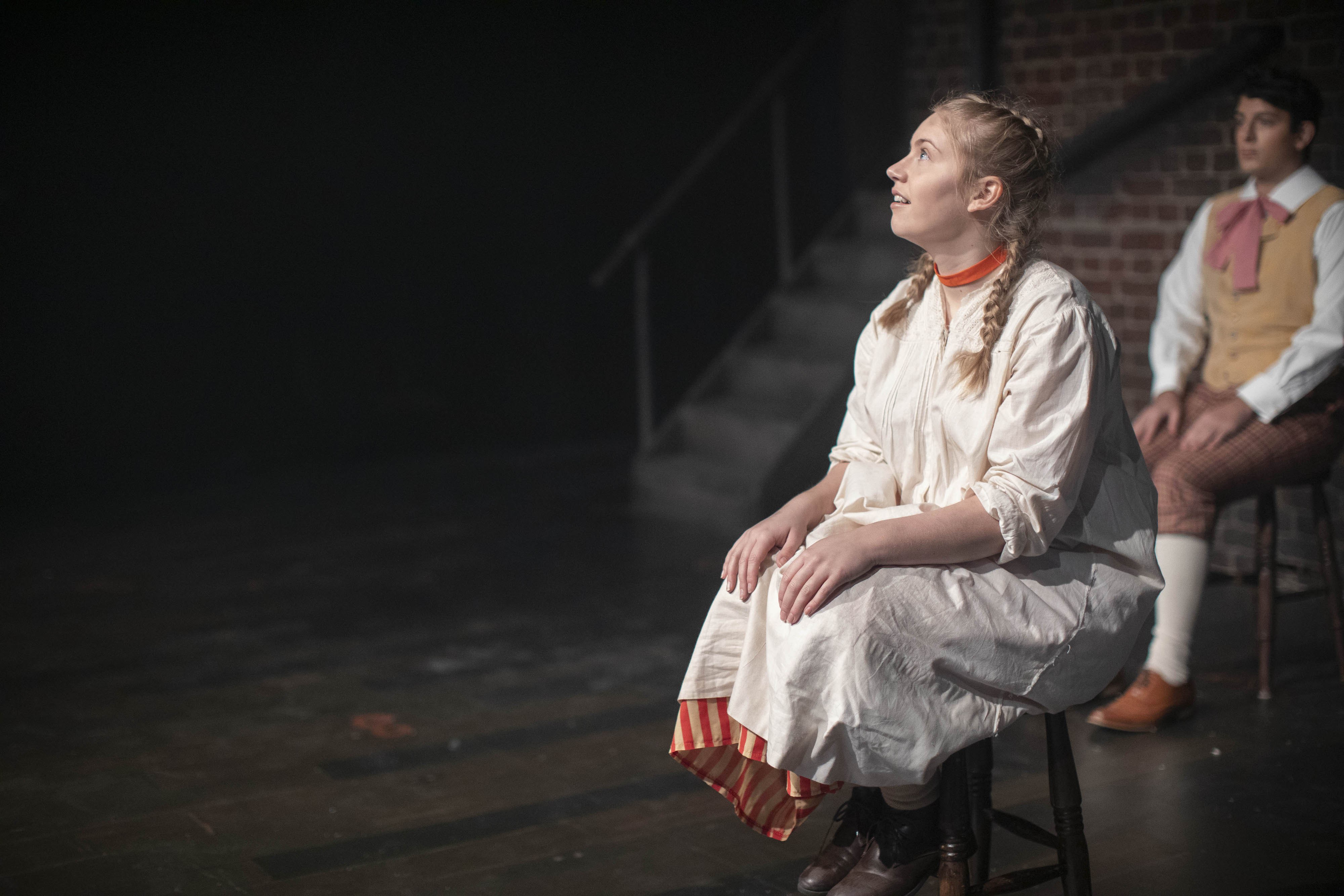 Students acting in a production of Hard Times