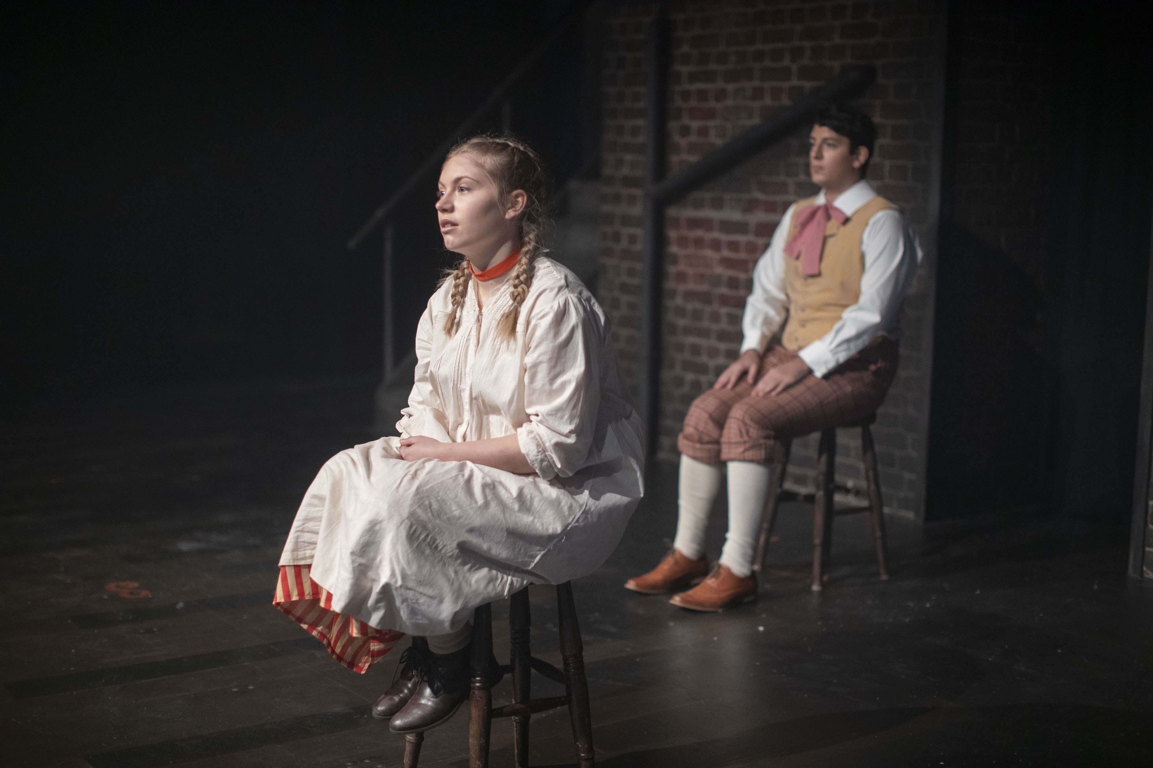 Students acting in a production of Hard Times