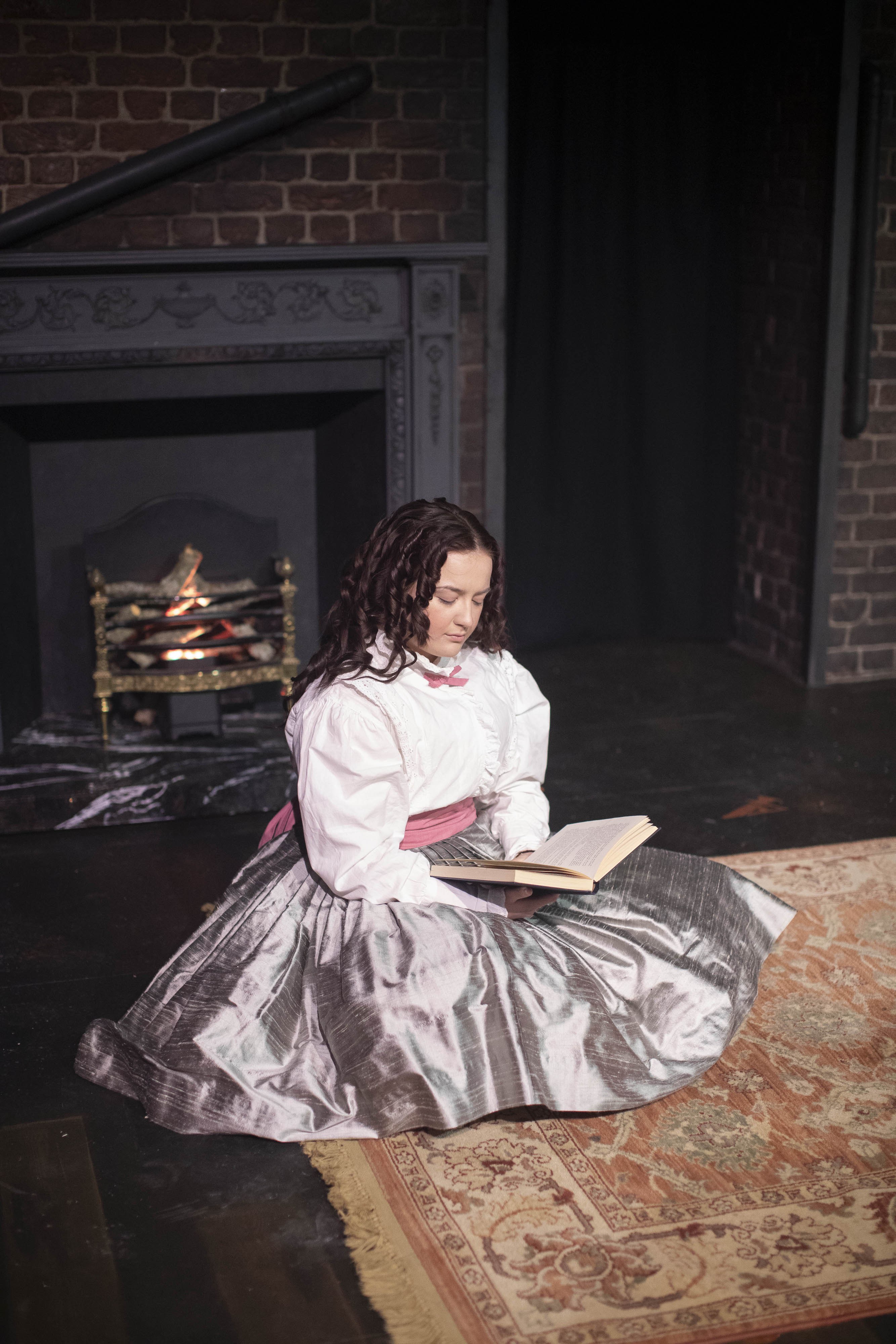 Students acting in a production of Hard Times